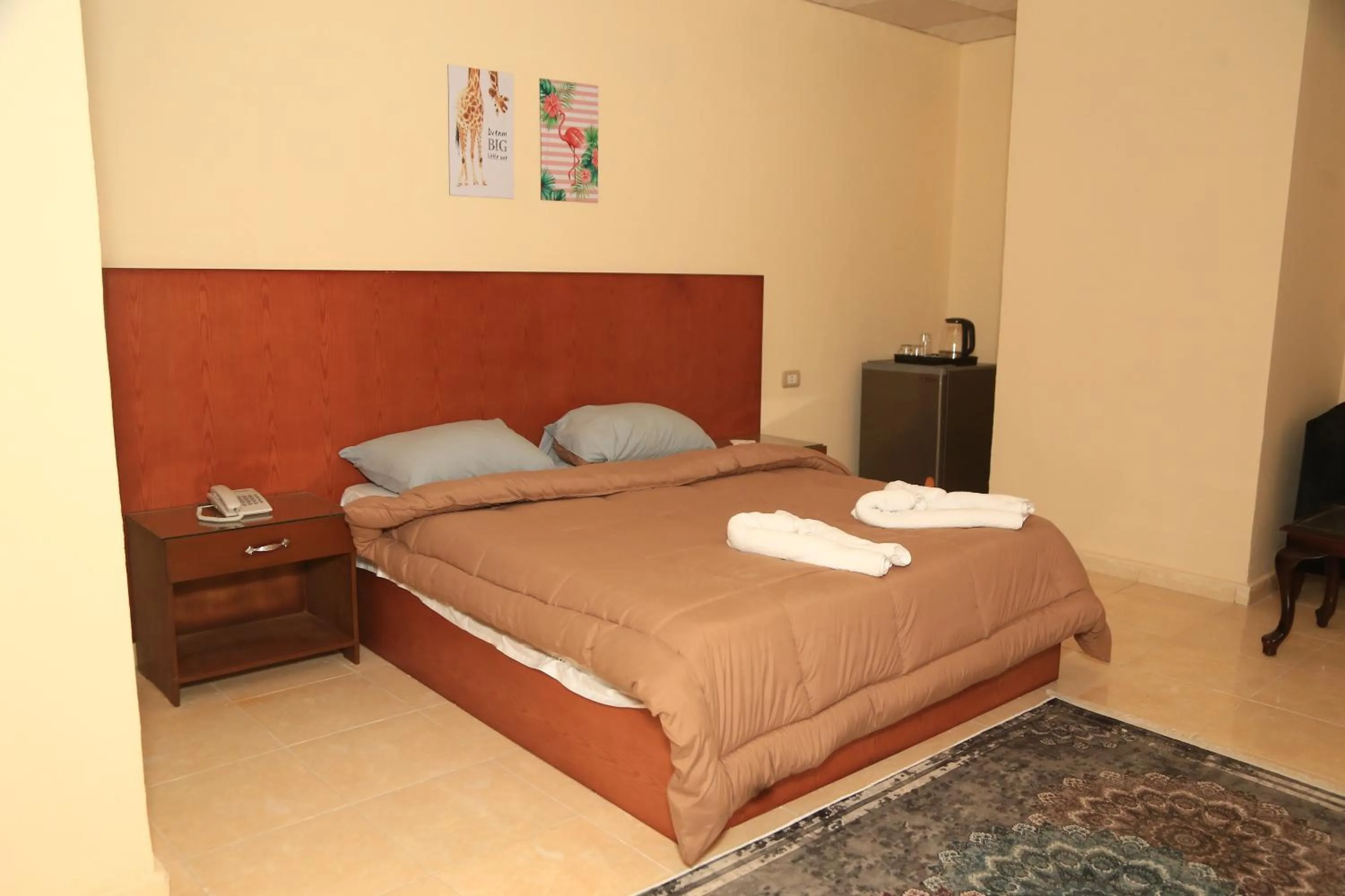 Bed in Verssailles Pyramids Hotel