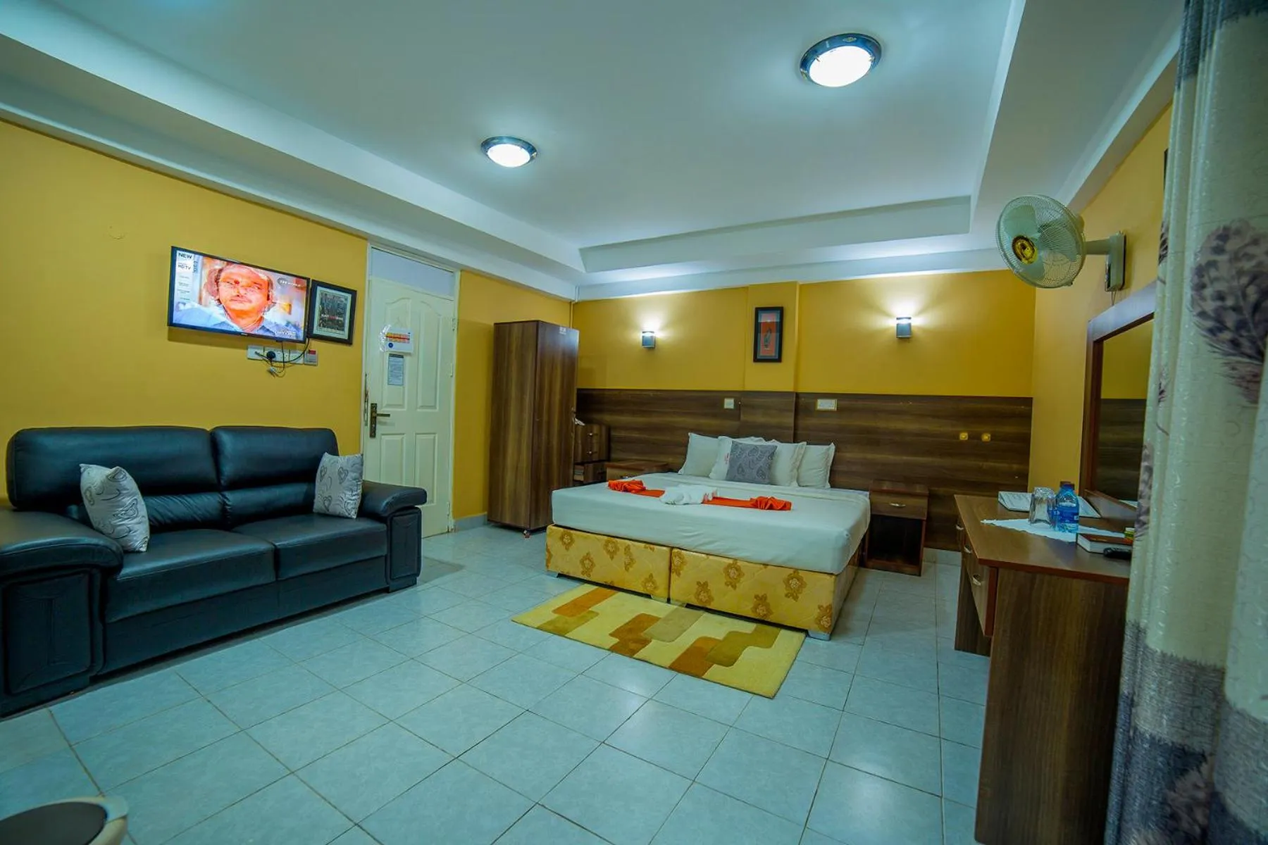 Communal lounge/ TV room in Eureka Place Hotel Kampala