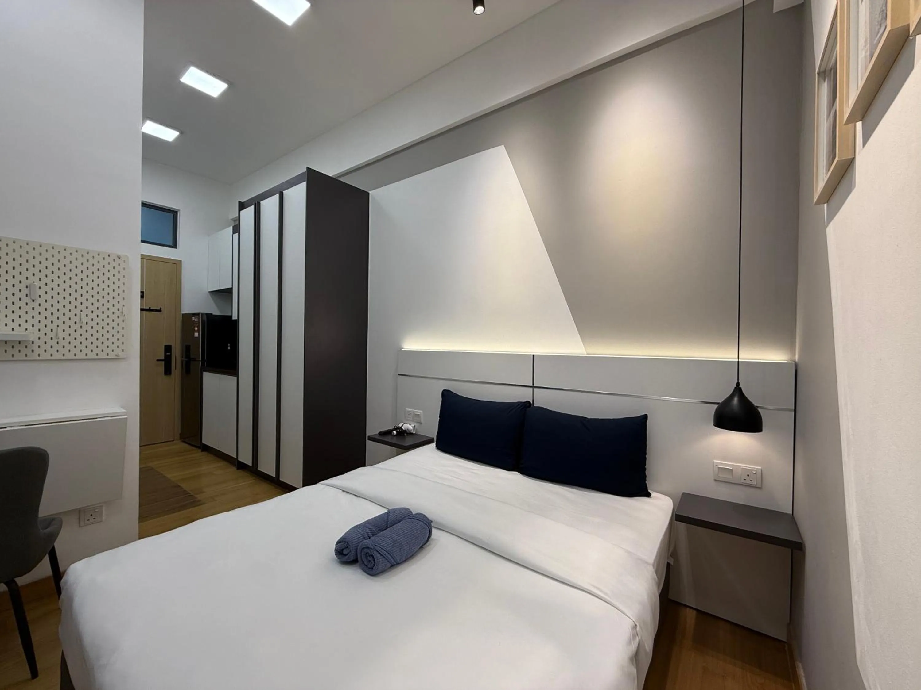 Bed in The Luxe by Infinitum Suites