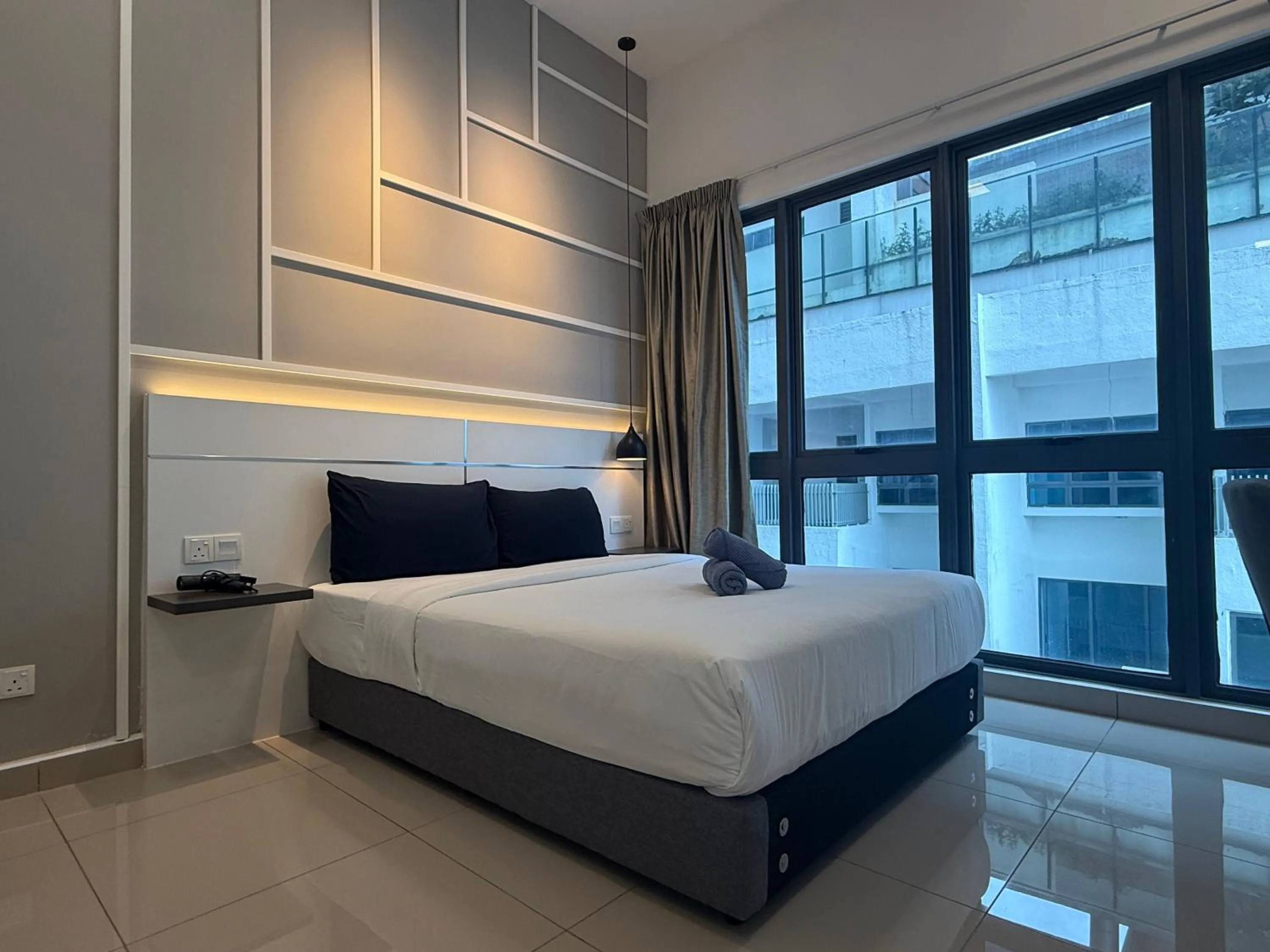 Bed in The Luxe by Infinitum Suites