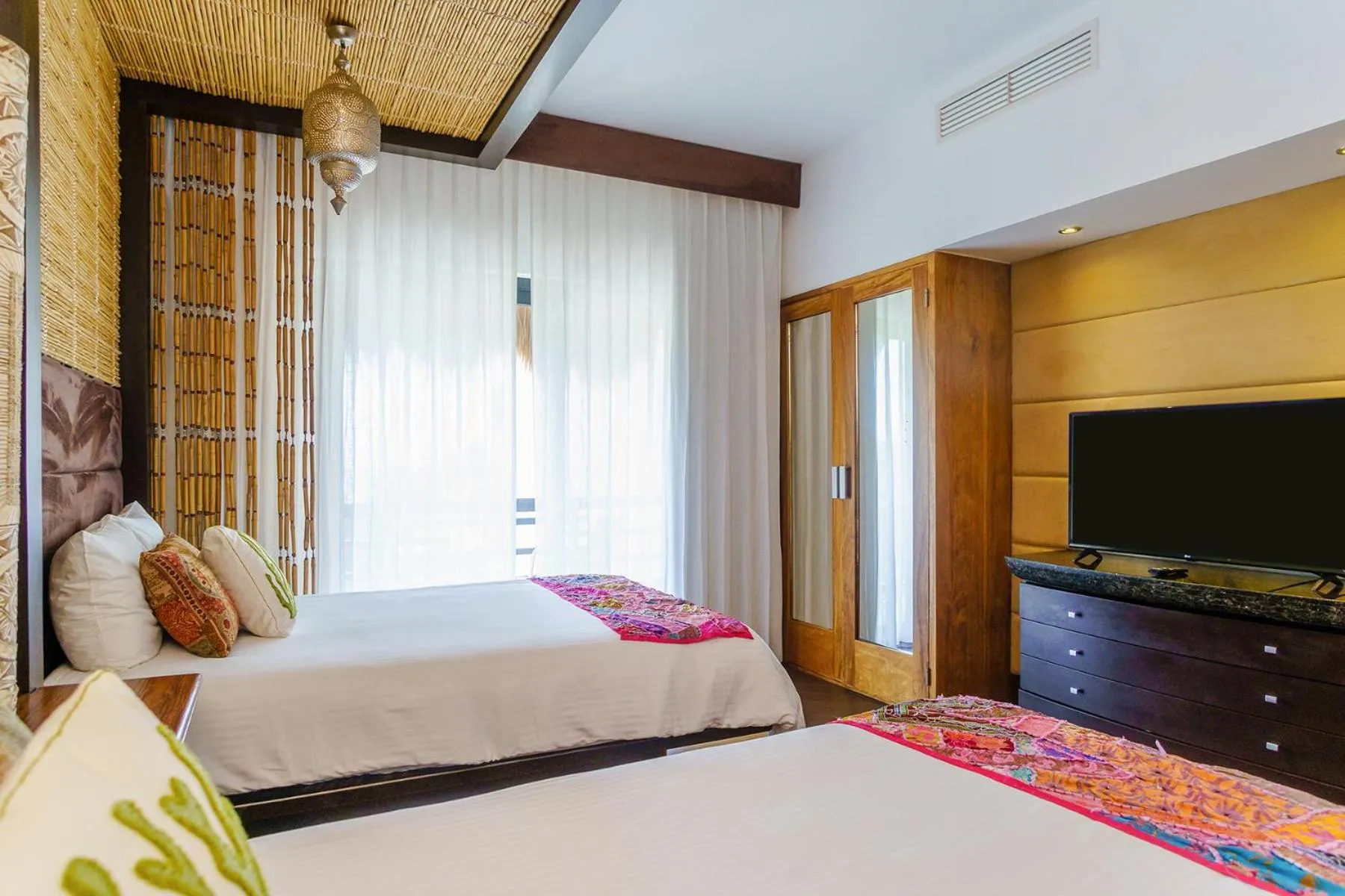 Bed in Aldea Thai by Stella Rentals