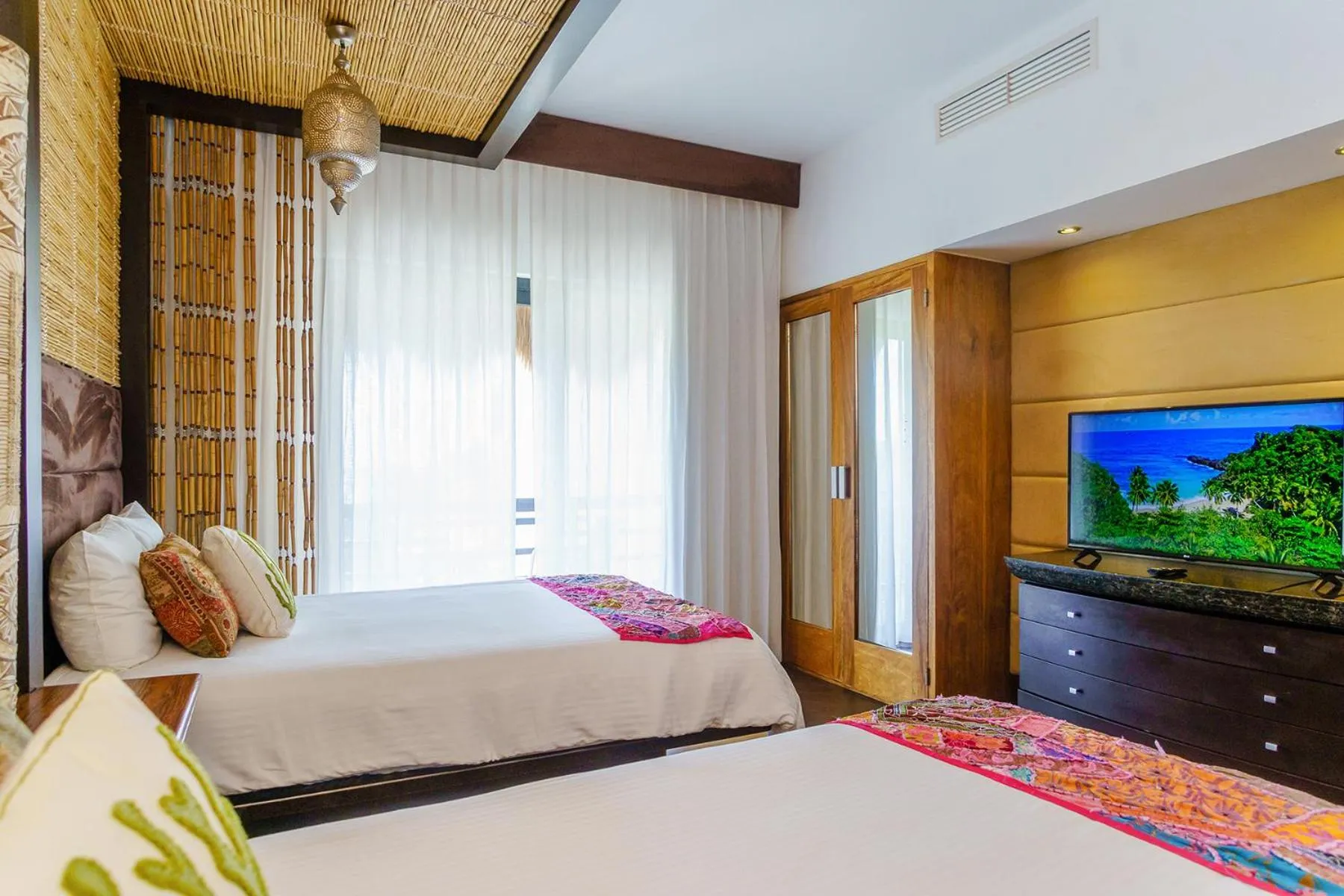 Bed in Aldea Thai by Stella Rentals