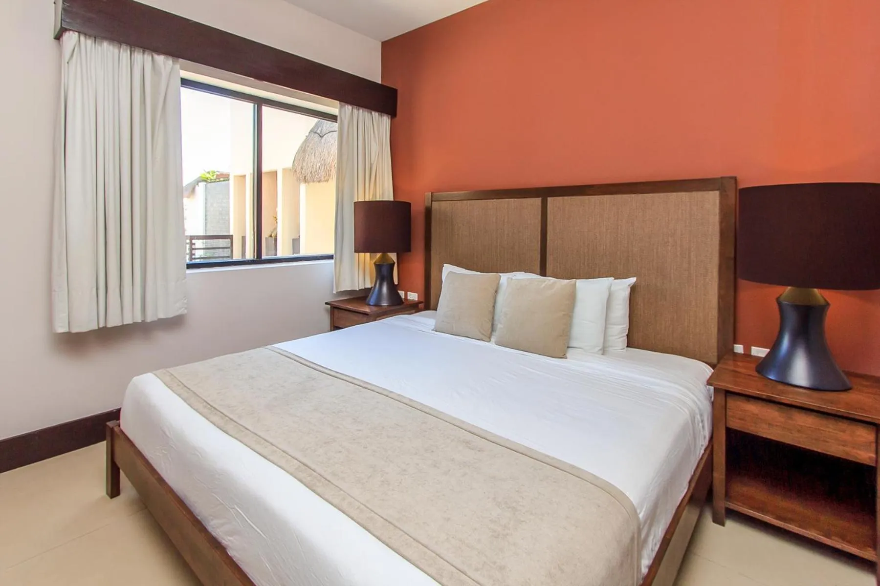 Bed in Aldea Thai by Stella Rentals