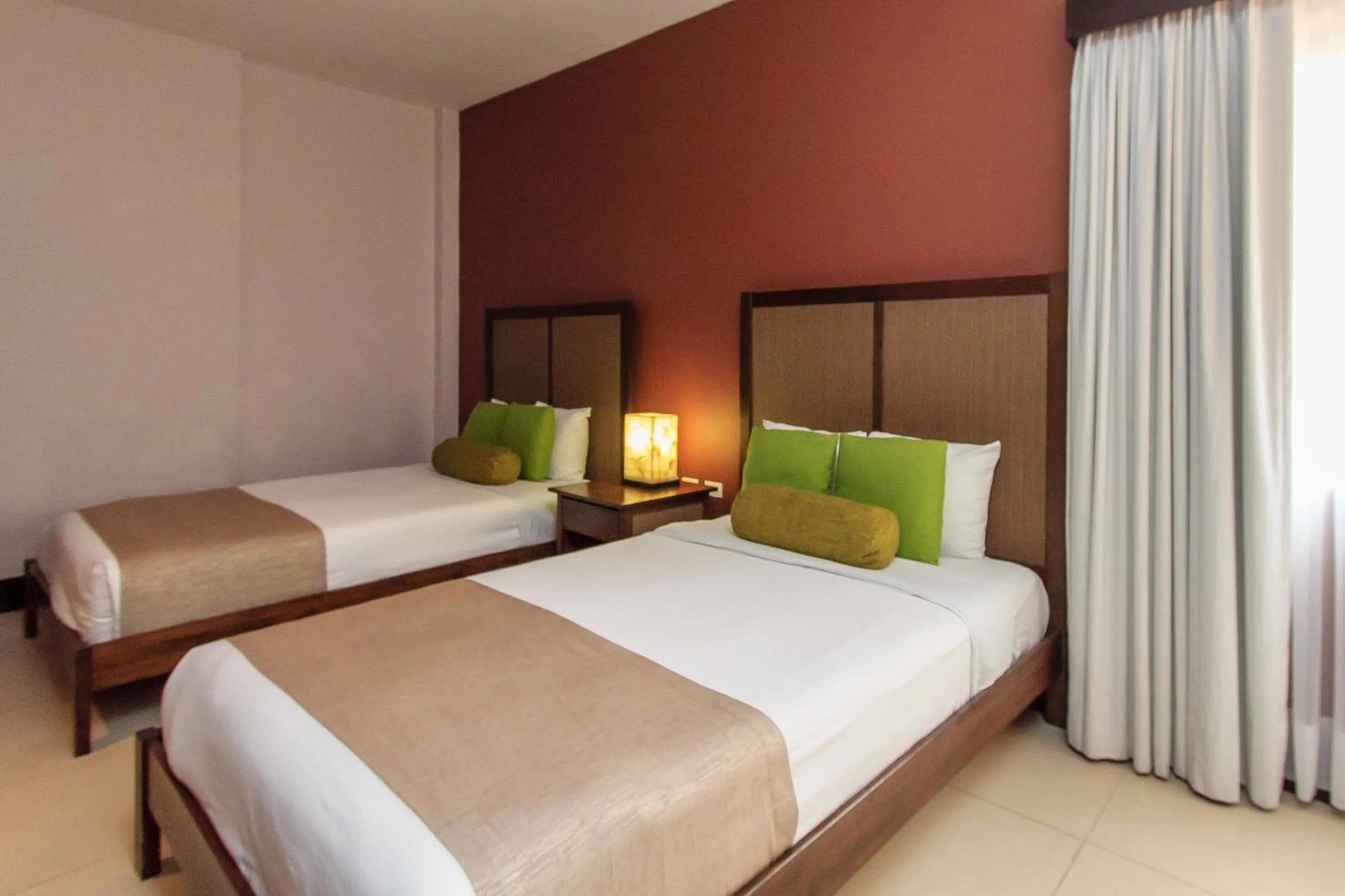 Bed in Aldea Thai by Stella Rentals