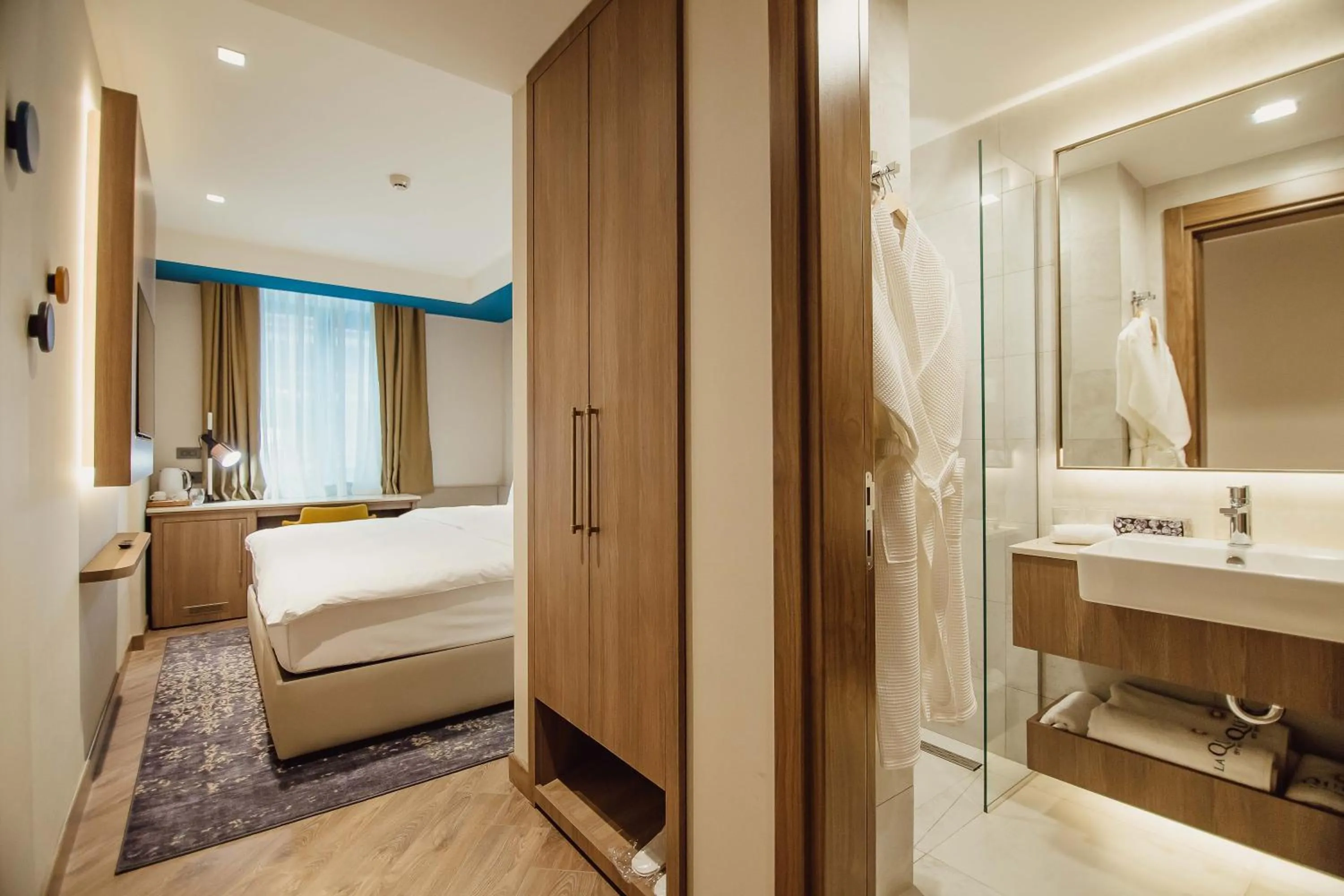 Bathroom, Bed in La Quinta by Wyndham Batumi