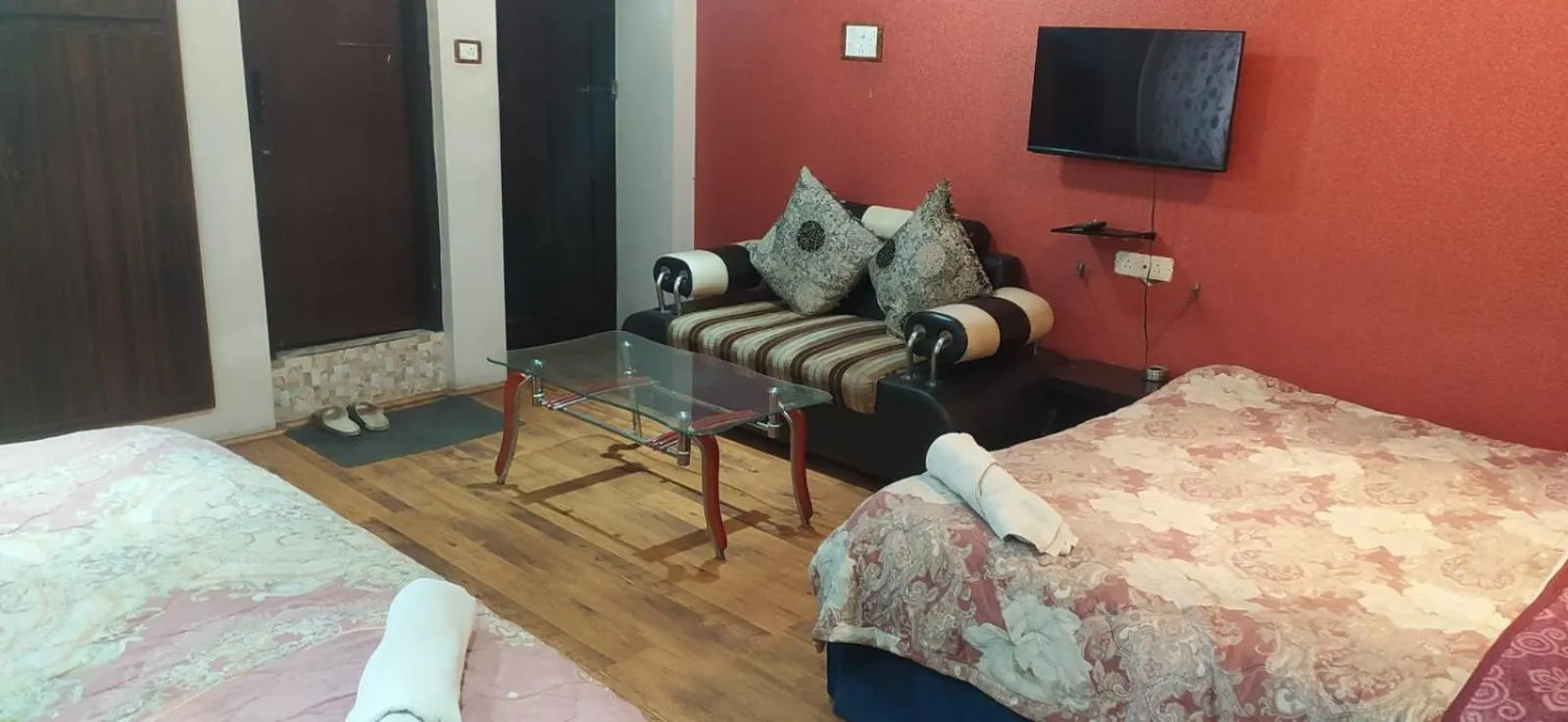 Bed in Heavenwood Heritage Hotel By Urban Inn Resorts