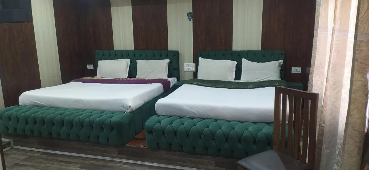 Bed in Heavenwood Heritage Hotel By Urban Inn Resorts