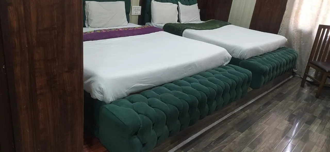 Bed in Heavenwood Heritage Hotel By Urban Inn Resorts
