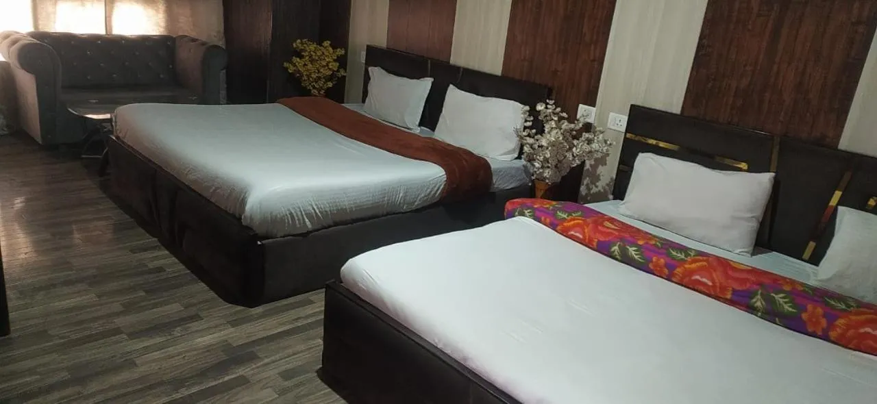 Bed in Heavenwood Heritage Hotel By Urban Inn Resorts