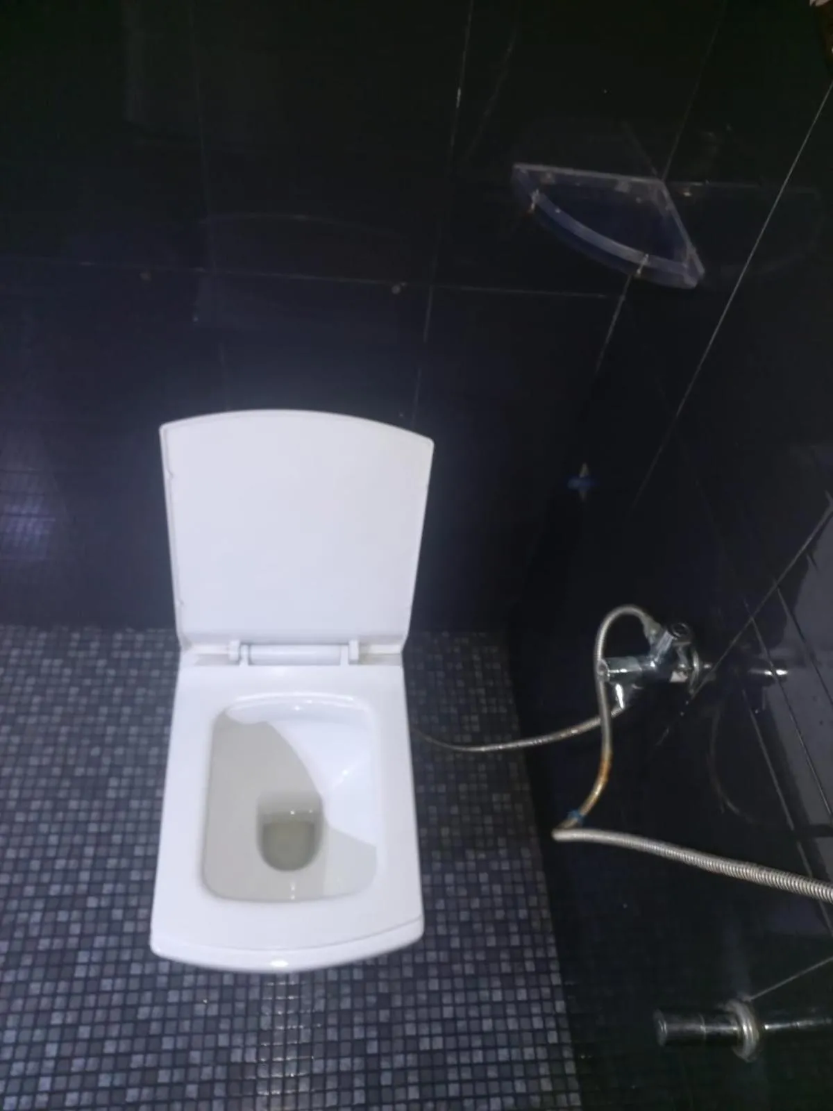 Toilet in Heavenwood Heritage Hotel By Urban Inn Resorts