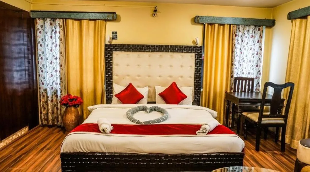Bed in Heavenwood Heritage Hotel By Urban Inn Resorts