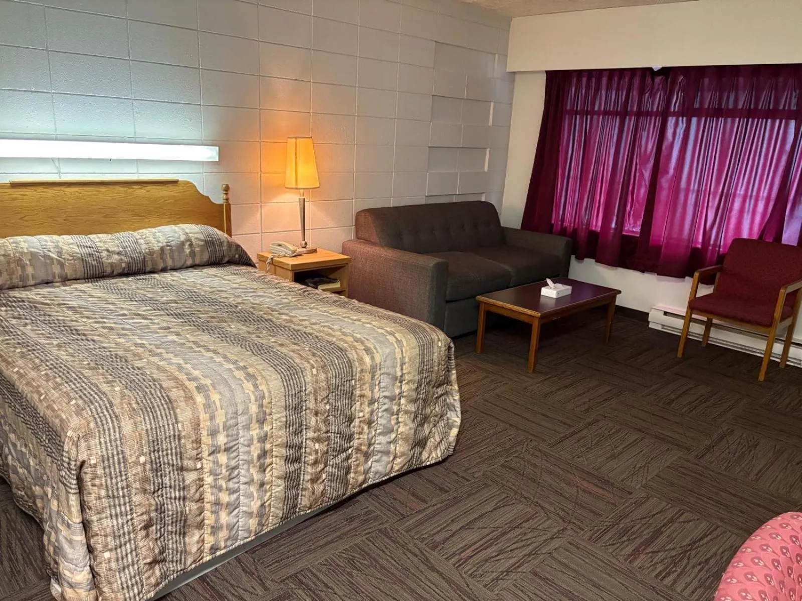 Bed in Camelot Court Motel