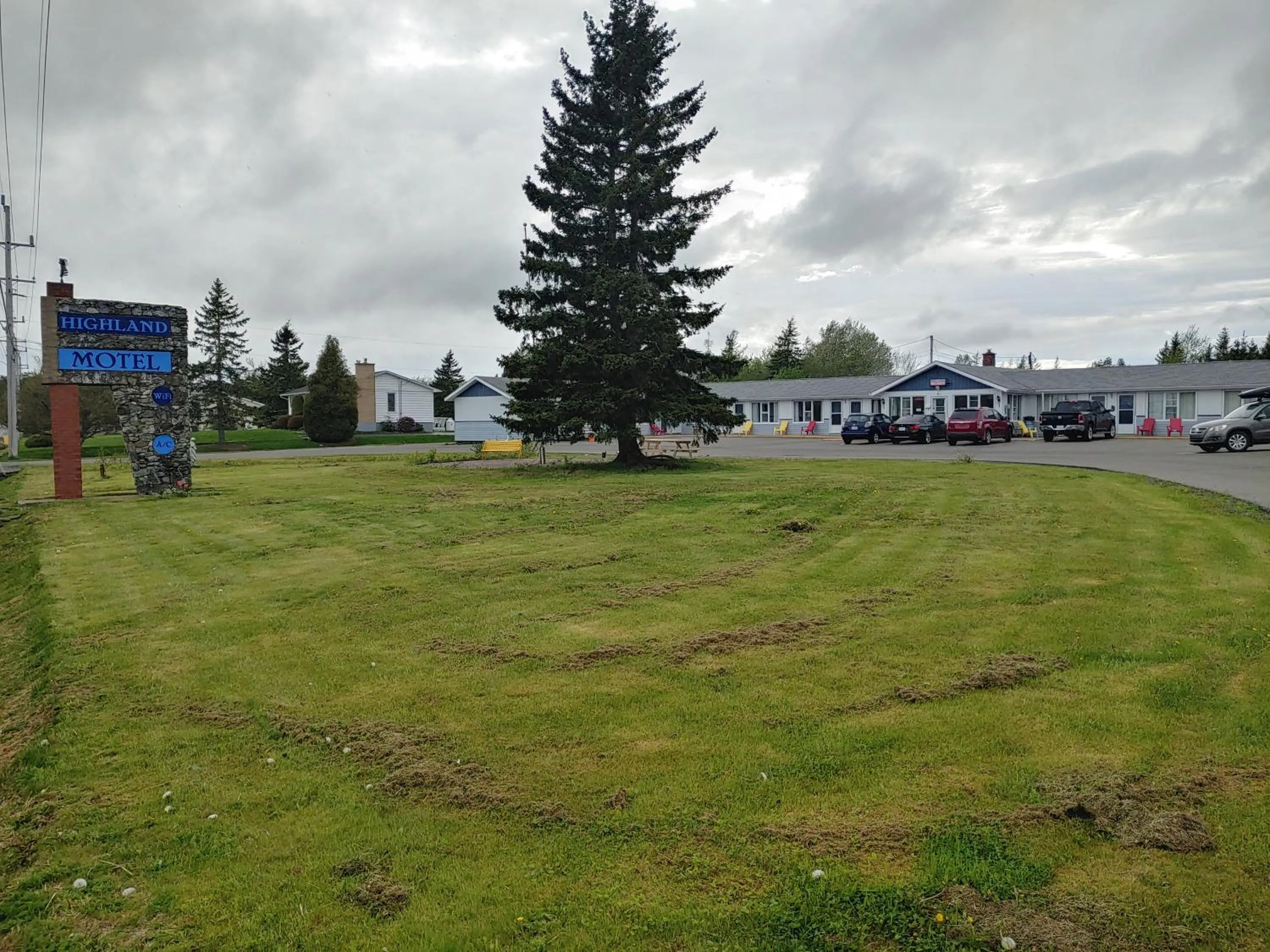 Property logo or sign in Highland Motel