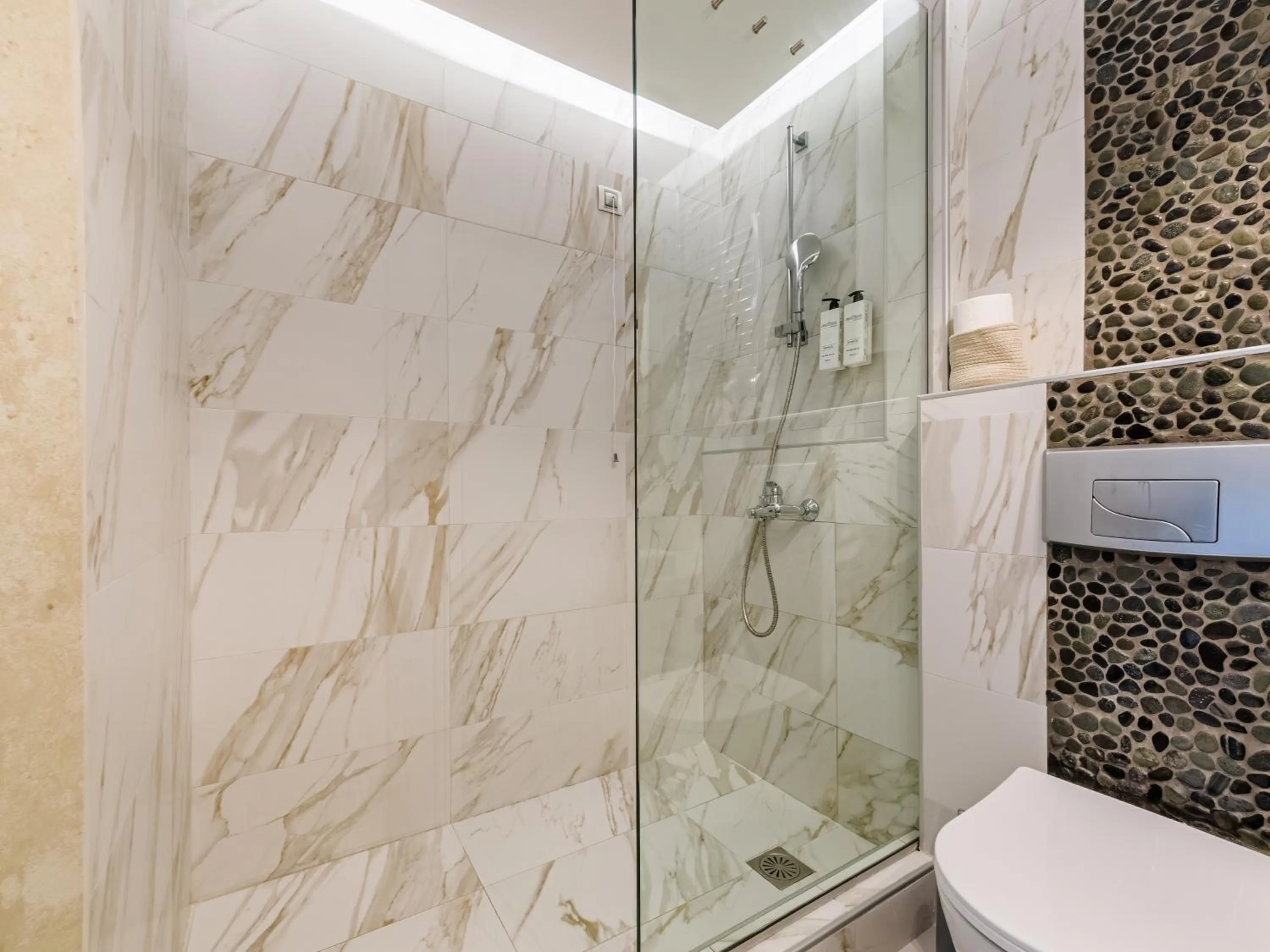 Shower in Alpha Luxury Suites