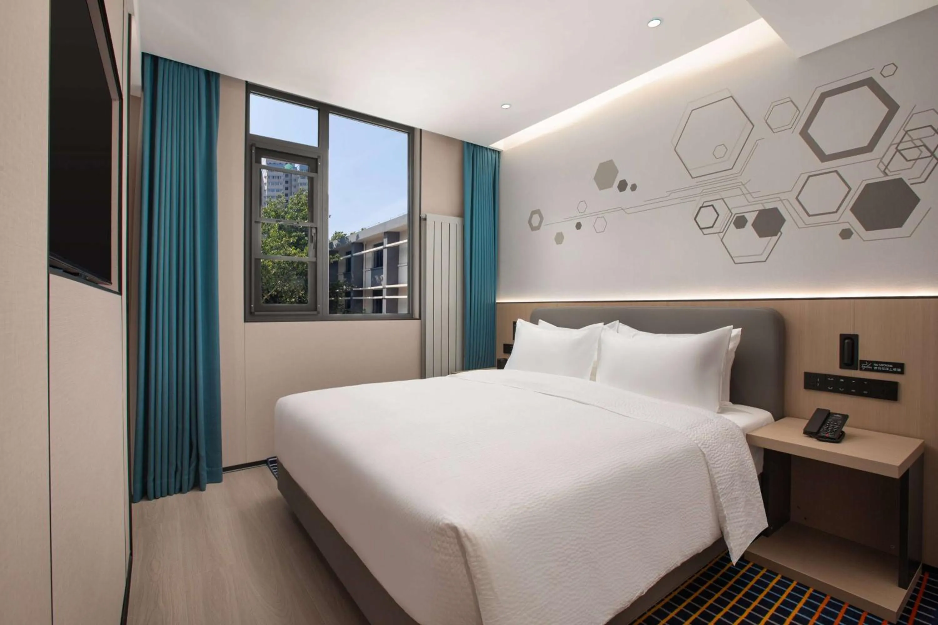 Photo of the whole room, Bed in Microtel by Wyndham Xian Beilin