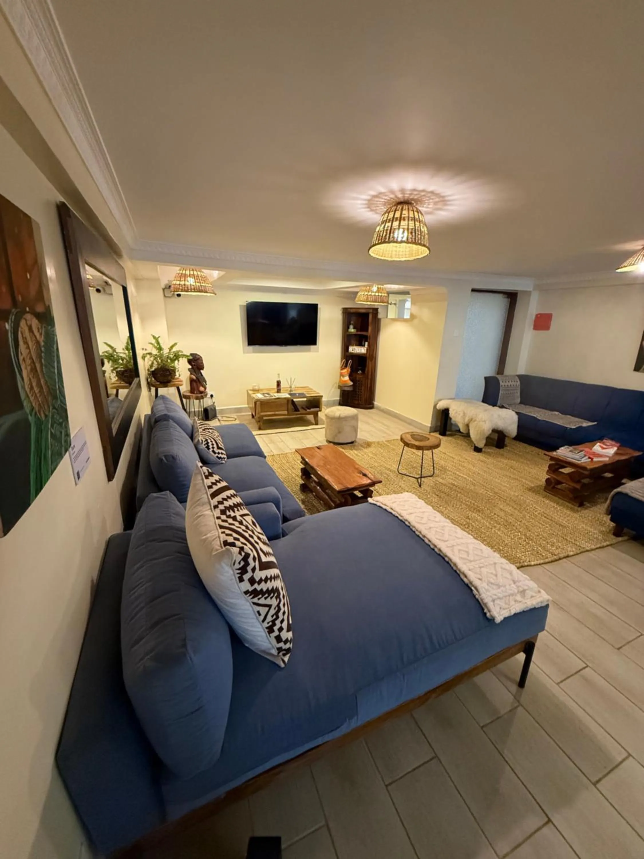 Communal lounge/ TV room, Bed in Karen Plains Hotel Nairobi