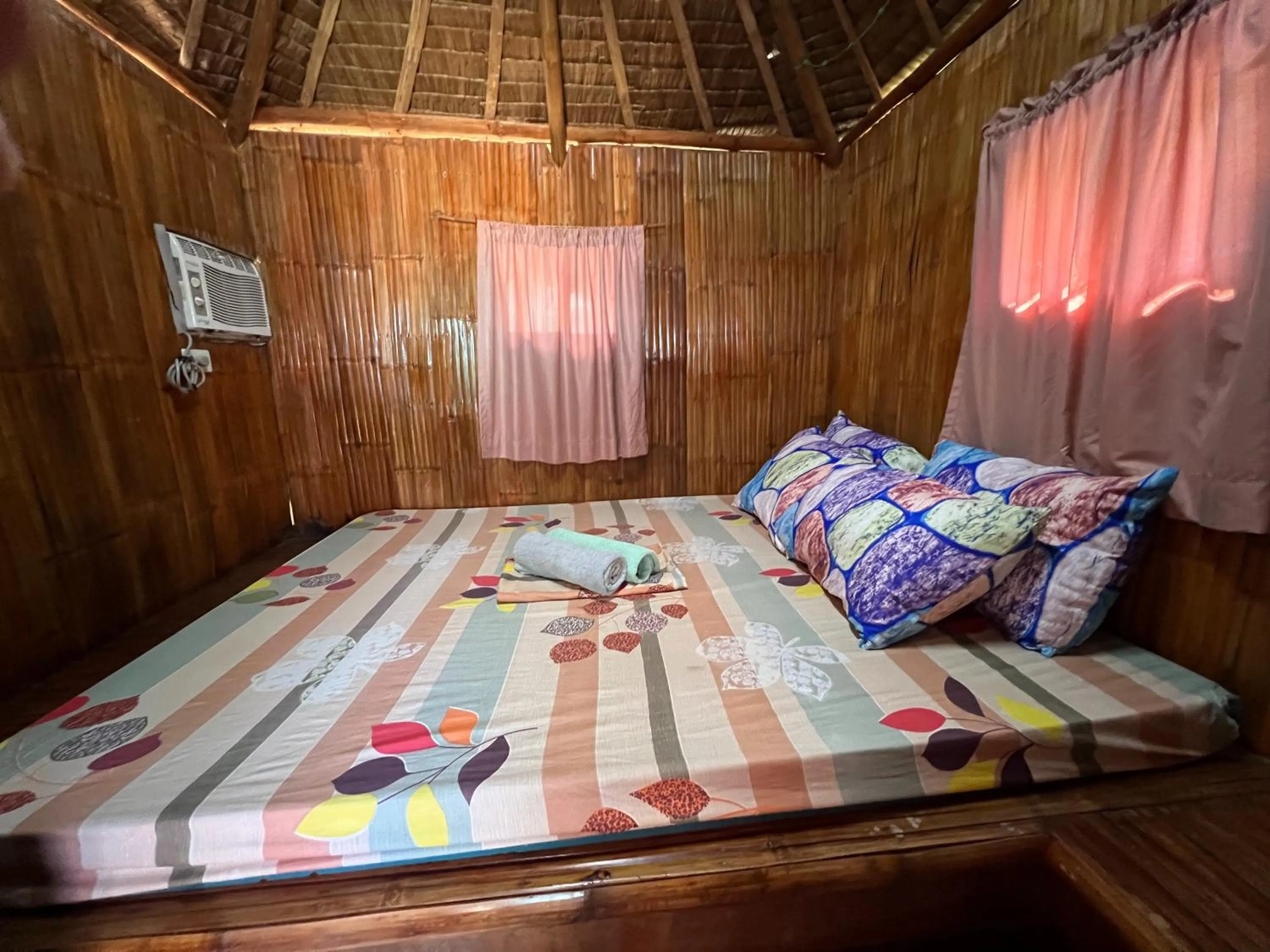 Bed in Lumiere Beachfront Resort