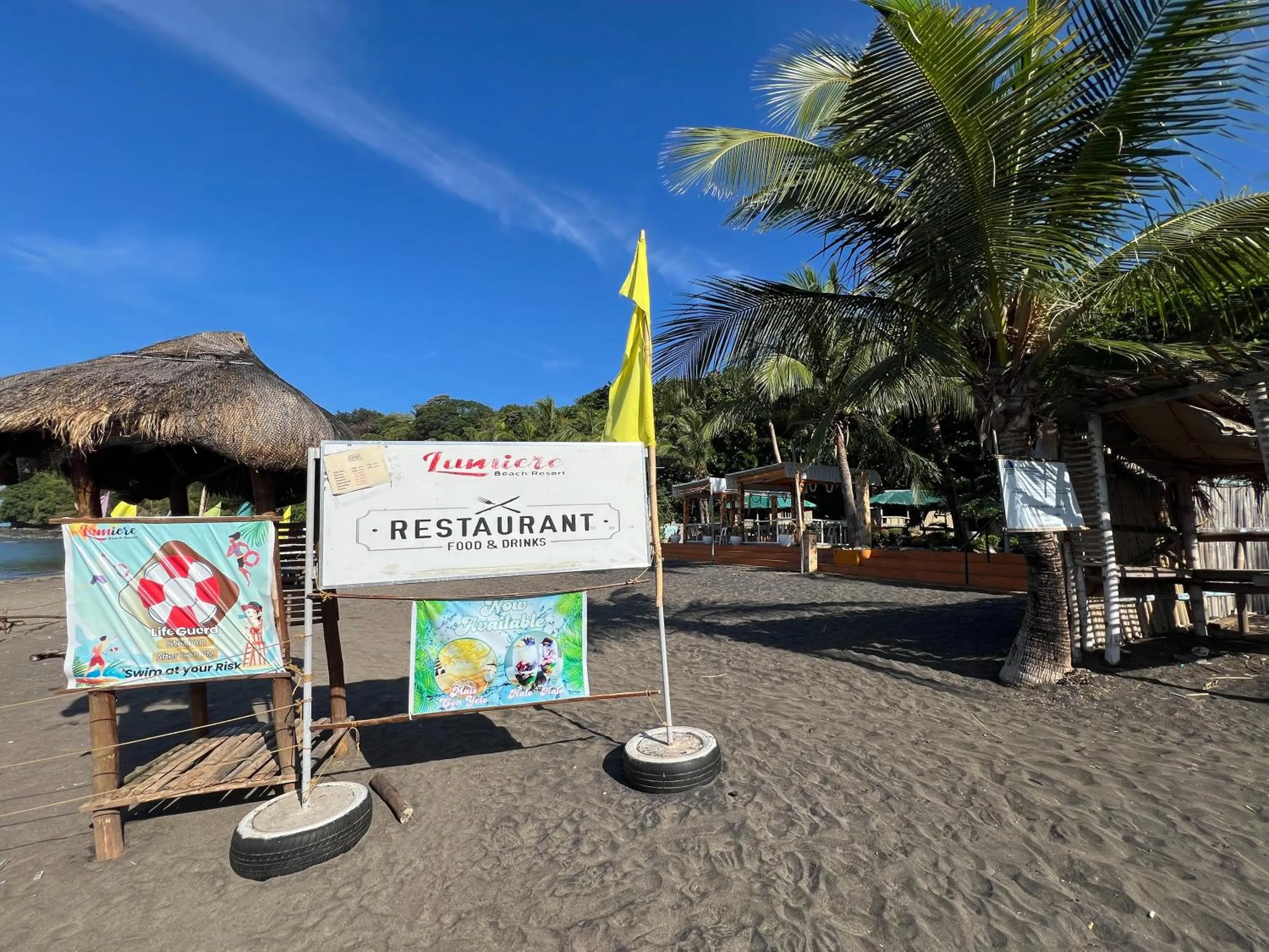 Property logo or sign in Lumiere Beachfront Resort