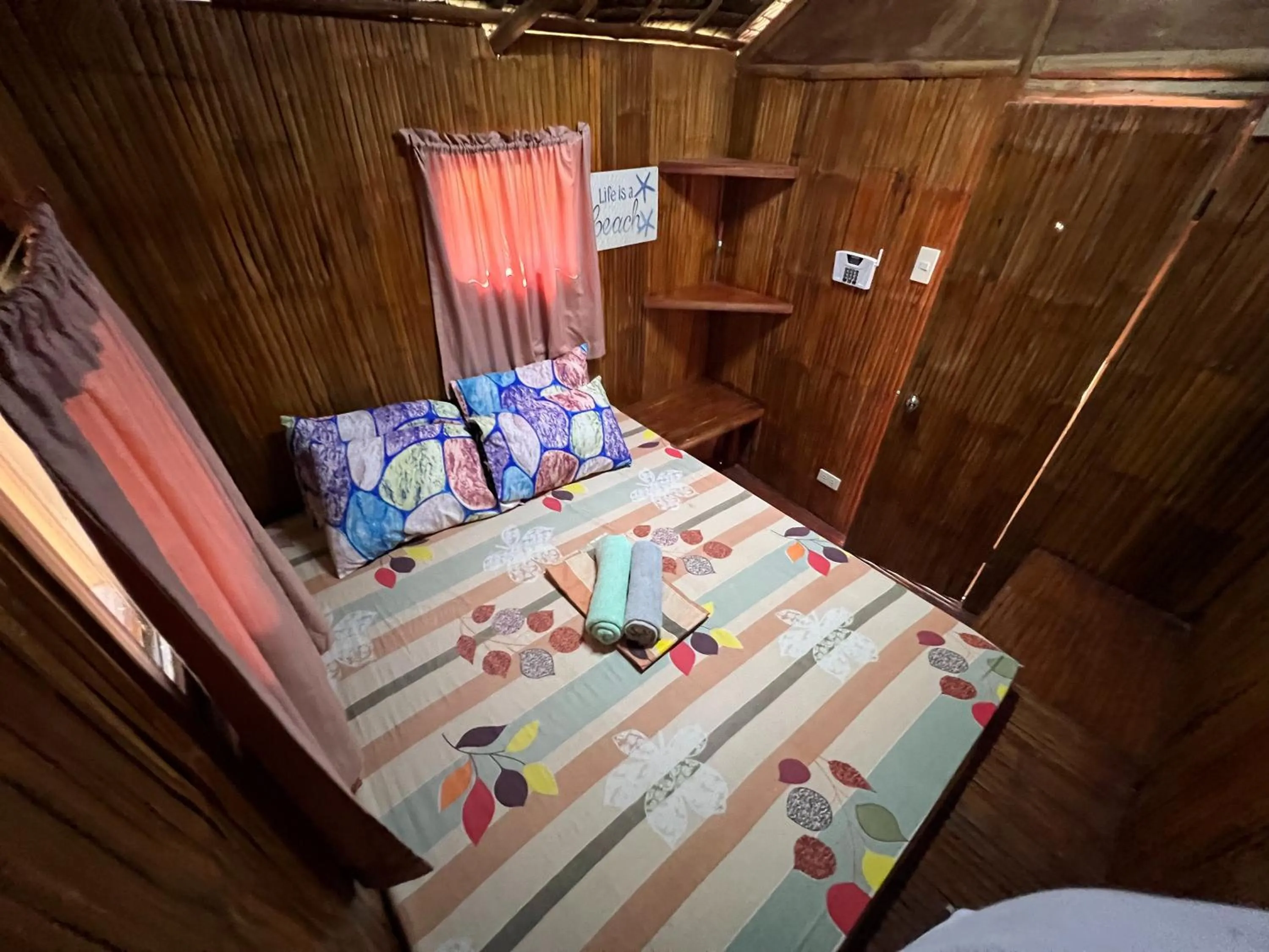 Bed in Lumiere Beachfront Resort