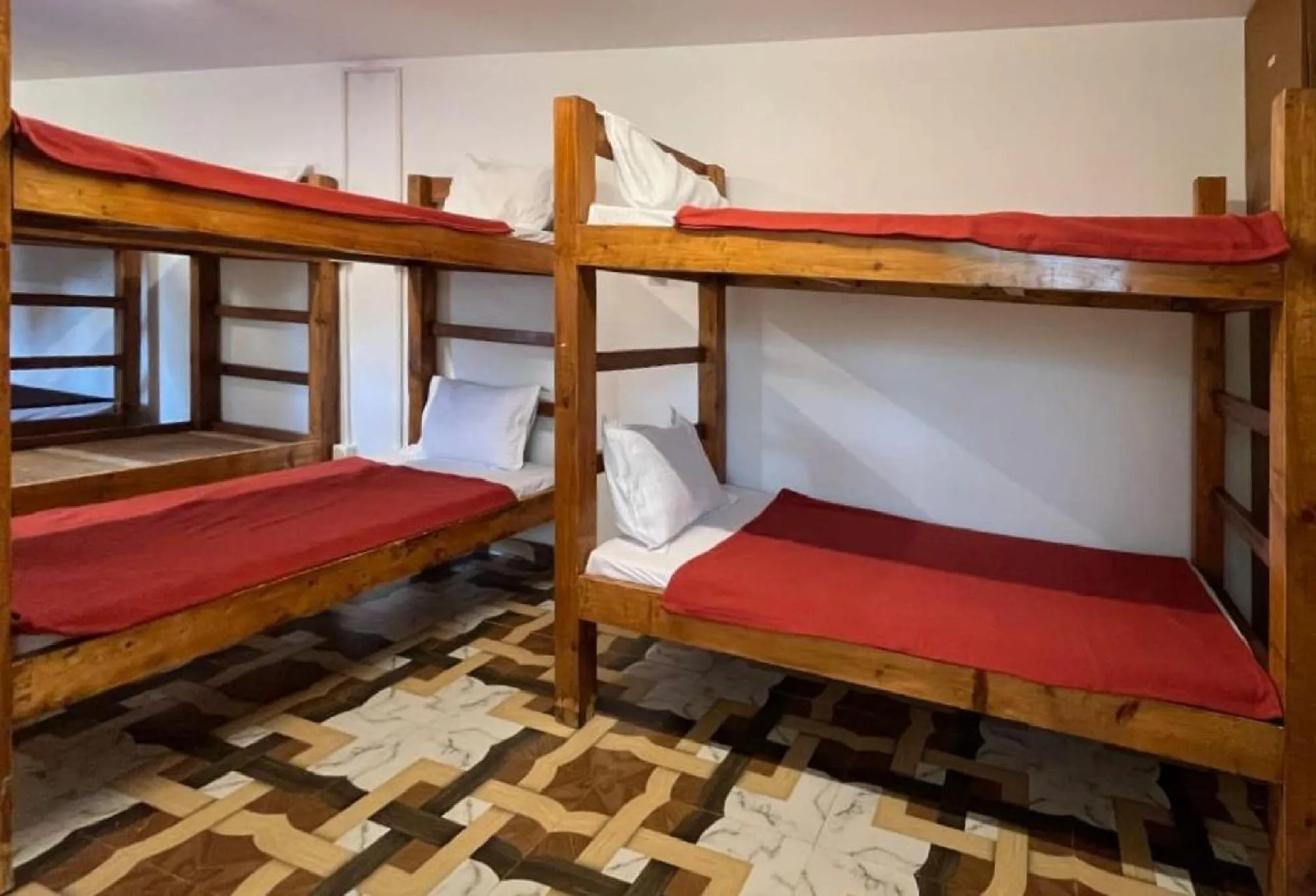 Bed in La Paulo's Back to Basic Beach Resort