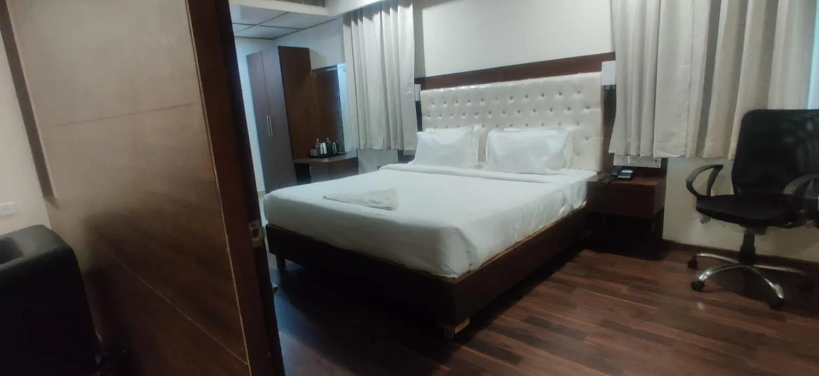 Bed in Hotel RN Grand