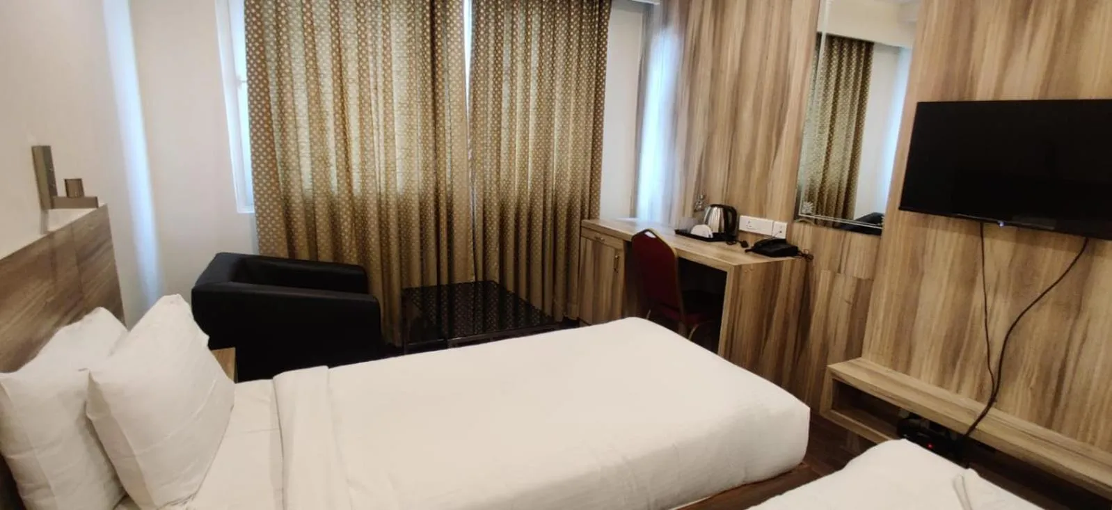 Bed in Hotel RN Grand