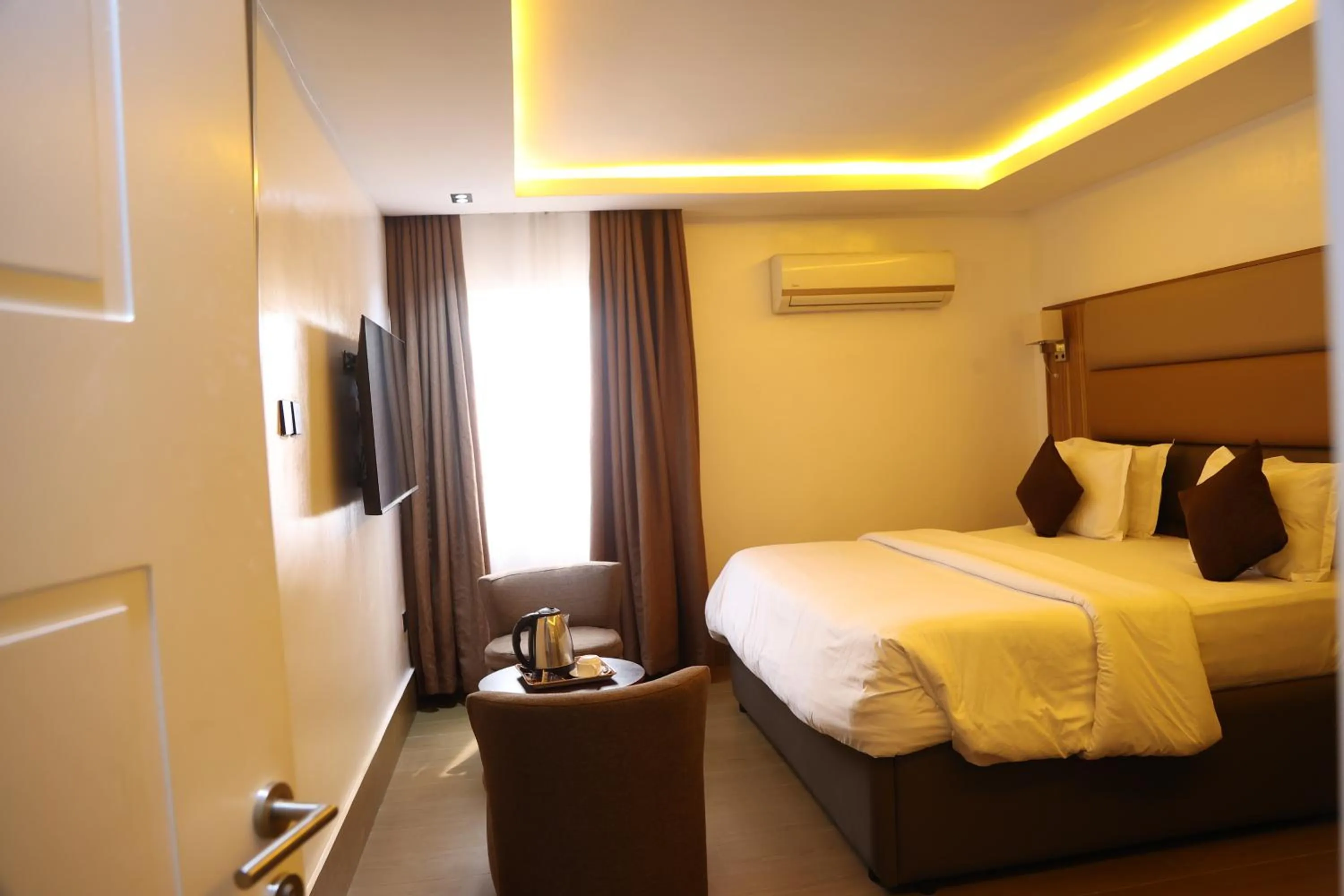 Bed in Bolton White Residence