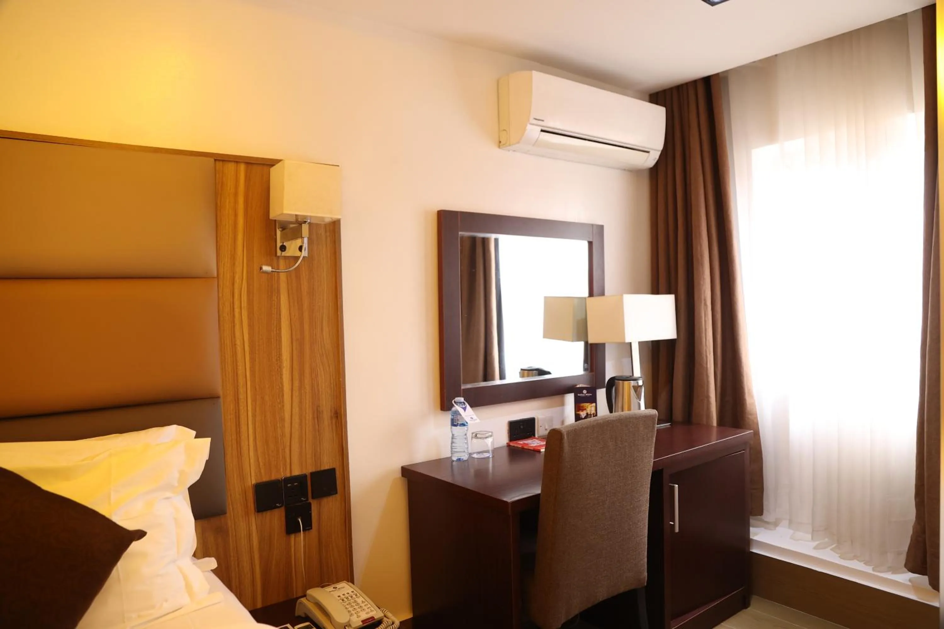 Bed in Bolton White Residence