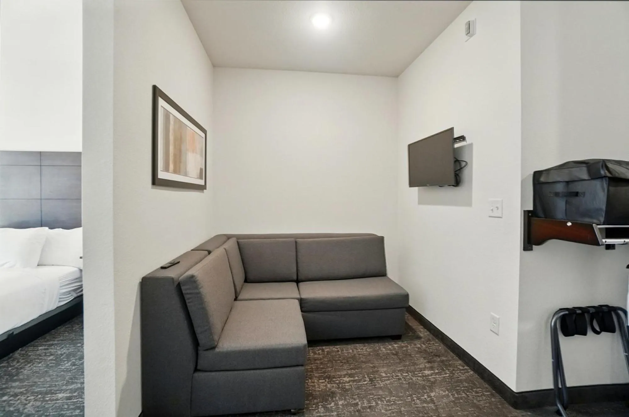 Seating area, Bed in Cobblestone Hotel & Suites - Eaton