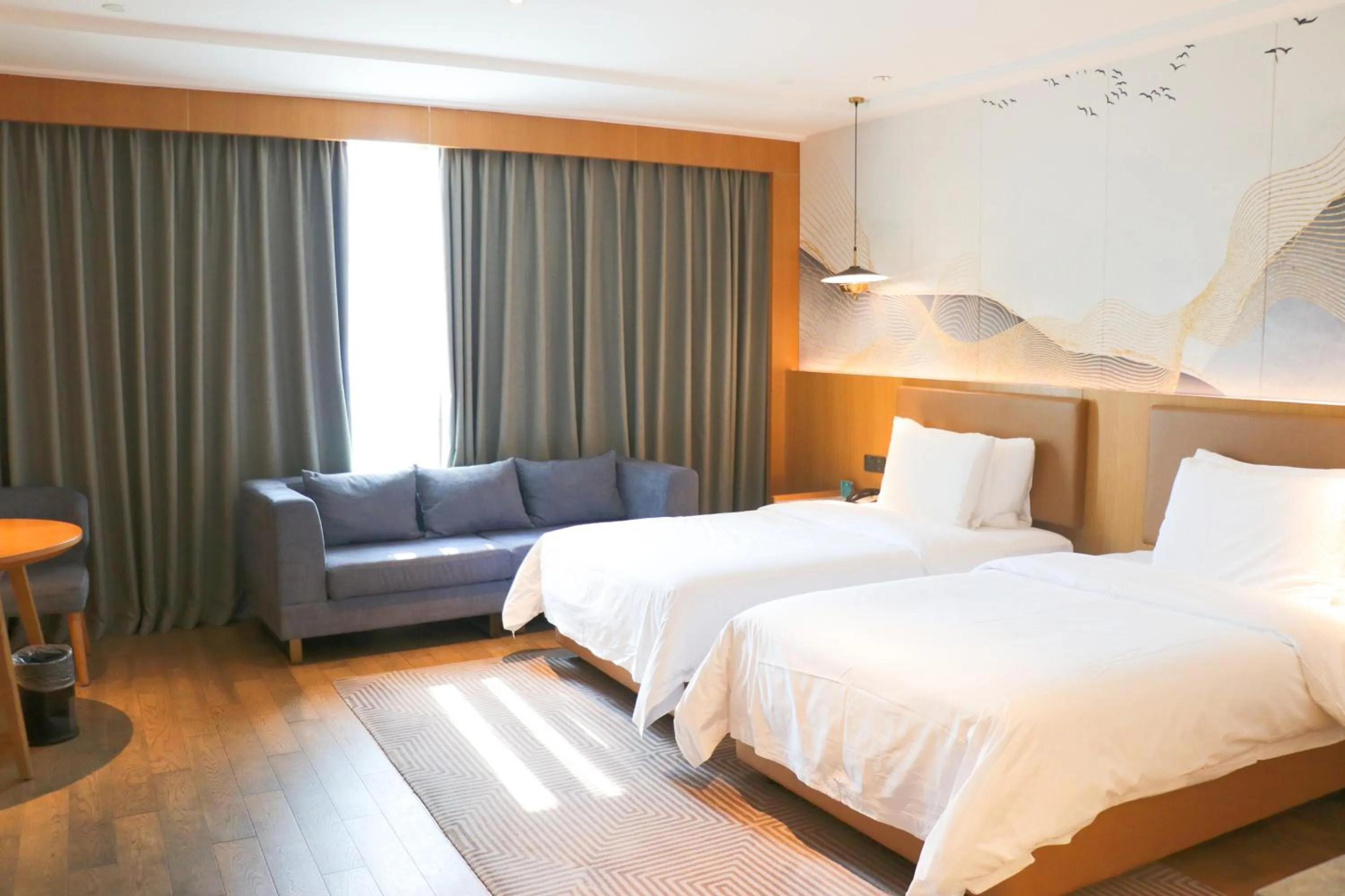 Bed in New Century Grand Hotel Changxing