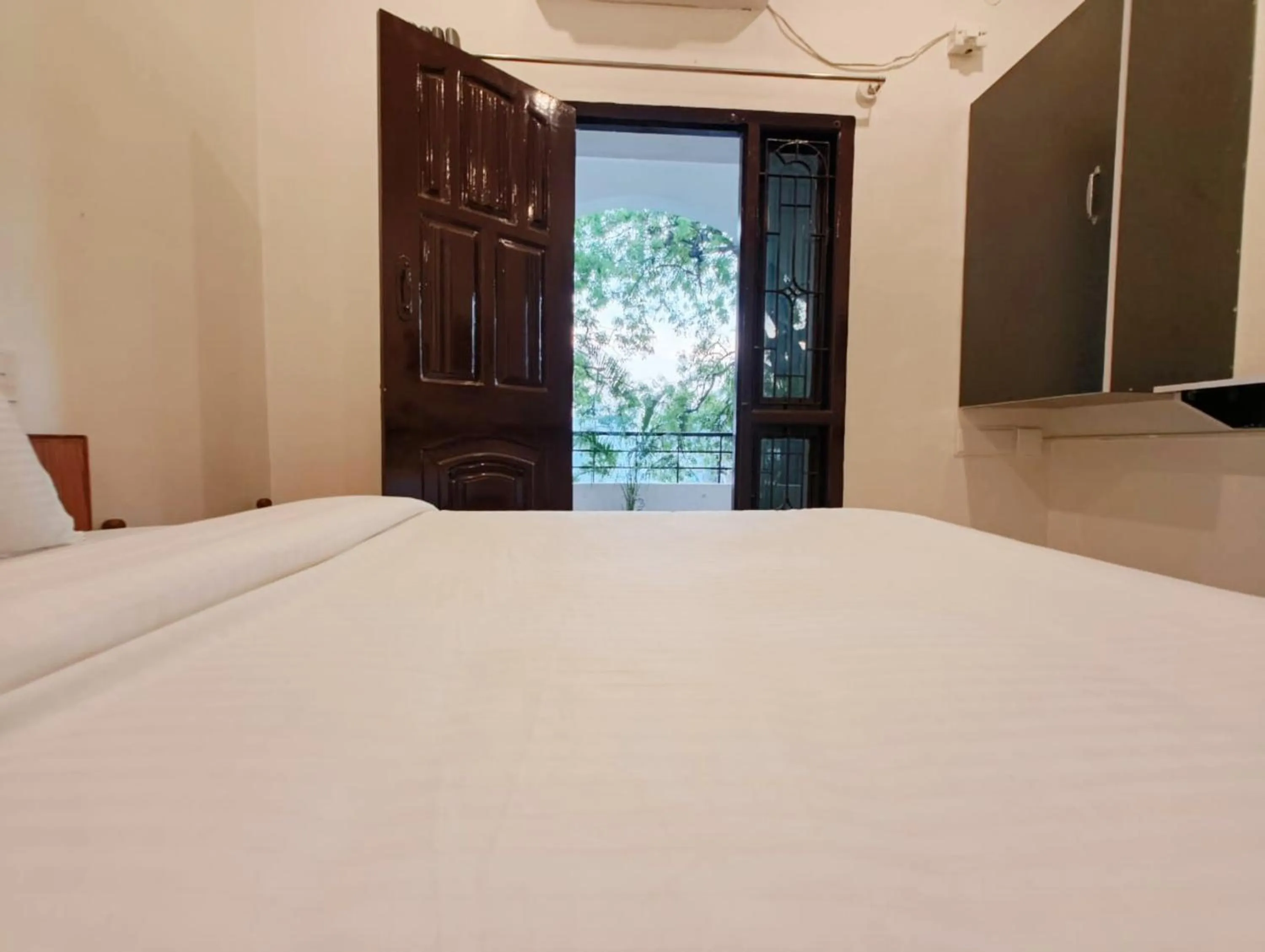 Balcony/Terrace, Bed in Hare Rama Hare Krishna - EESHA Hotel