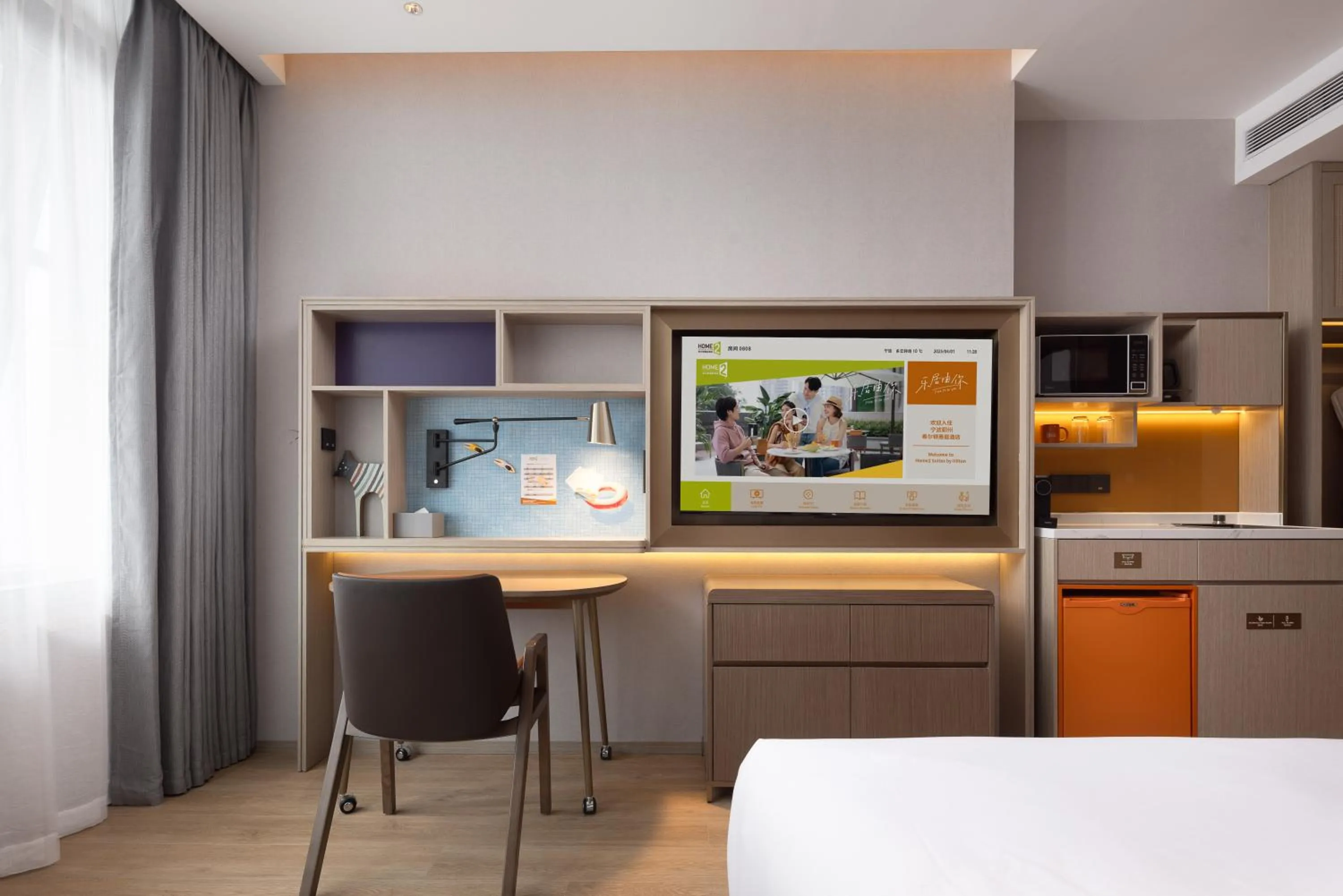TV and multimedia in Home2 Suite by Hilton Ningbo Yinzhou