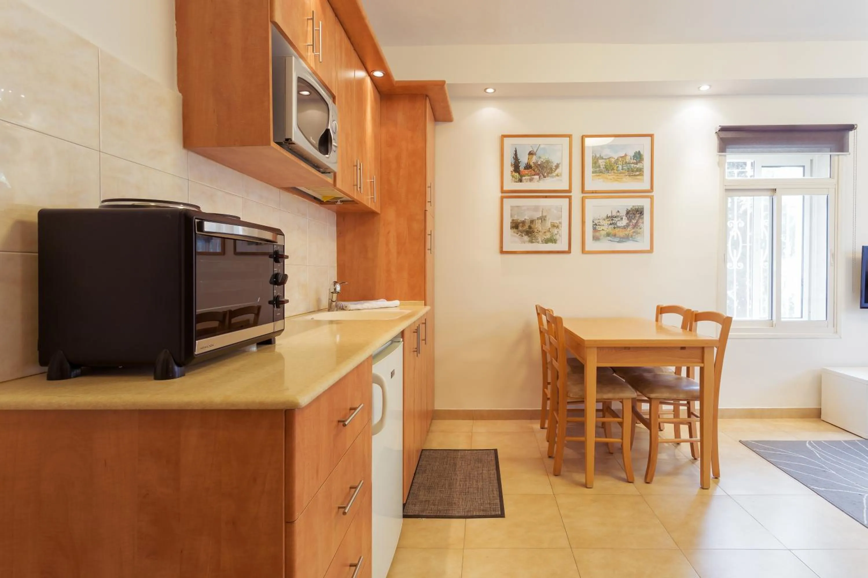 Kitchen or kitchenette in Colony Suites- Hananya St.
