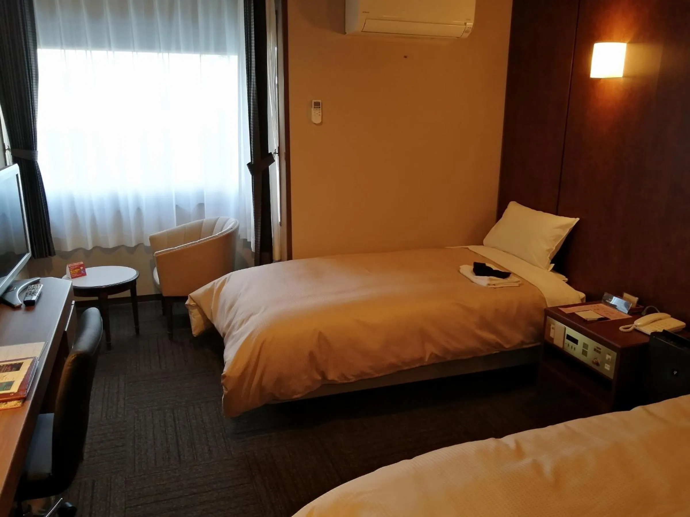 Bed in ホテル京都エミナースManyonoyuHotelKyotoEminence