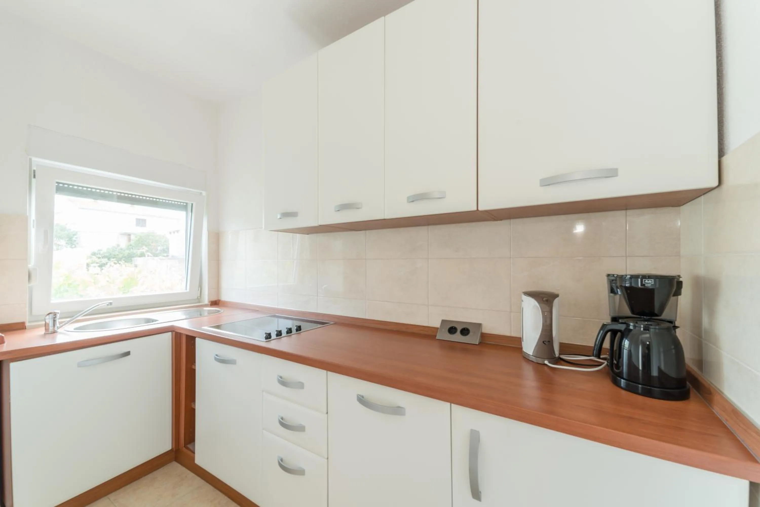 Kitchen or kitchenette in Apartments Brekalo