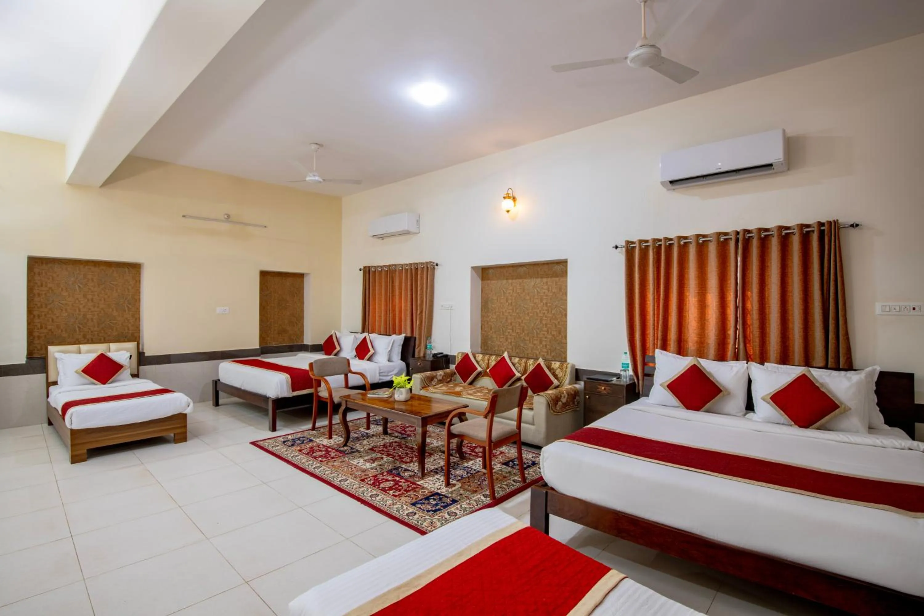 Seating area, Bed in Deora Resort and Hotel