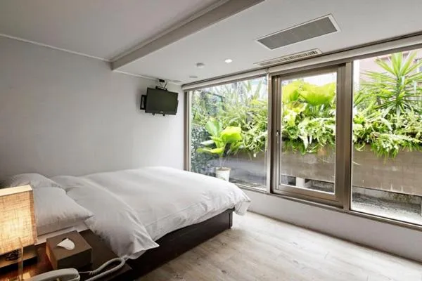 Bed in JBG Hotspring Resort Hotel