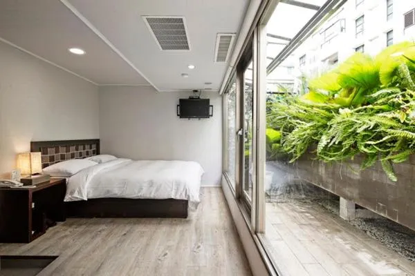 Bed in JBG Hotspring Resort Hotel