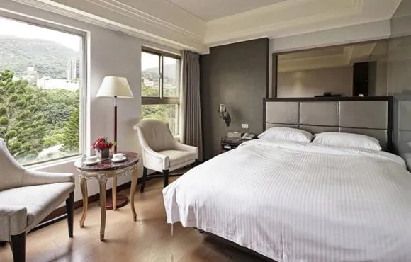 Bed in JBG Hotspring Resort Hotel