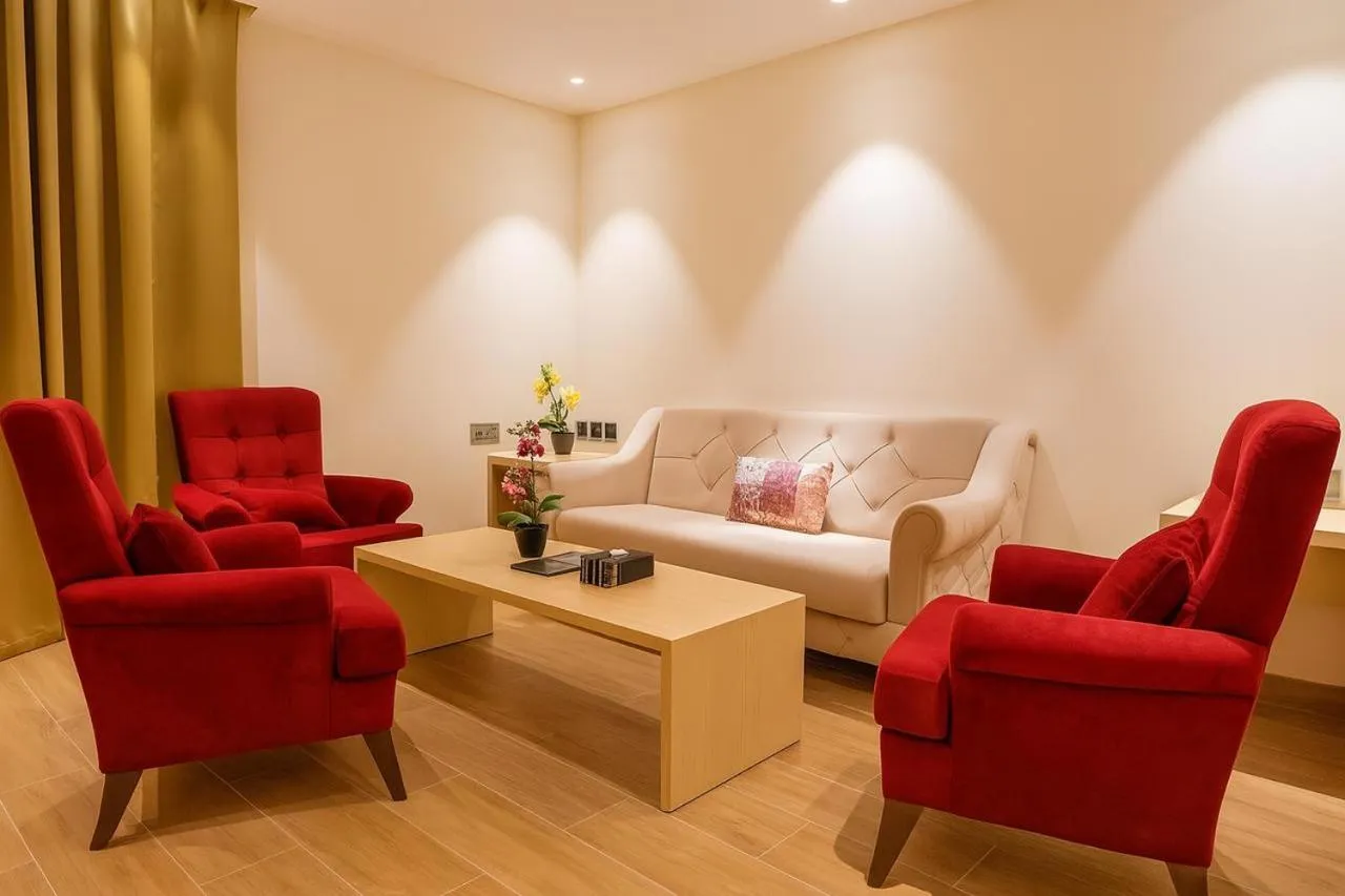 Living room, Bed in Falaj Daris Hotel