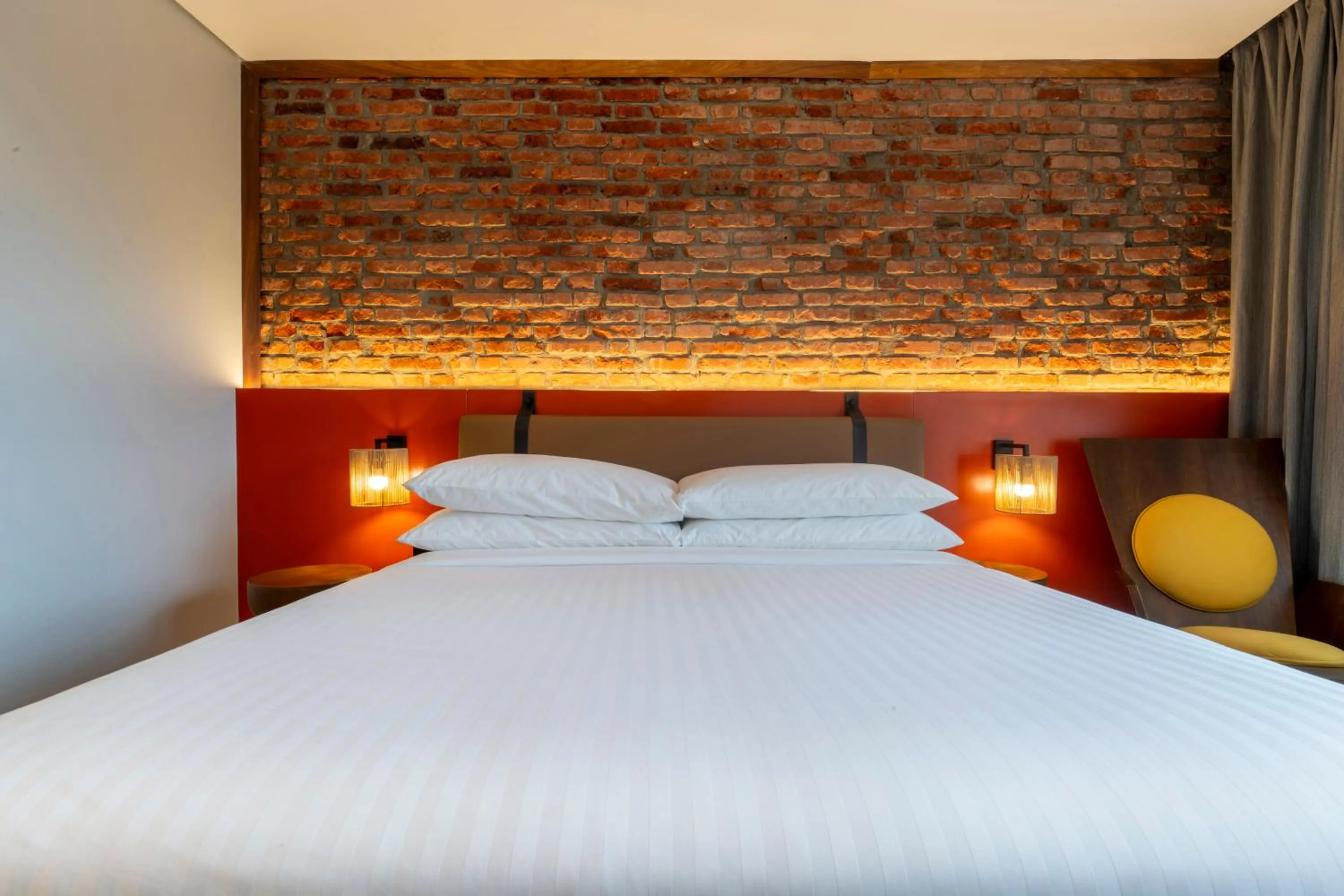 Bed in Zaria Court Kigali, Tapestry Collection by Hilton