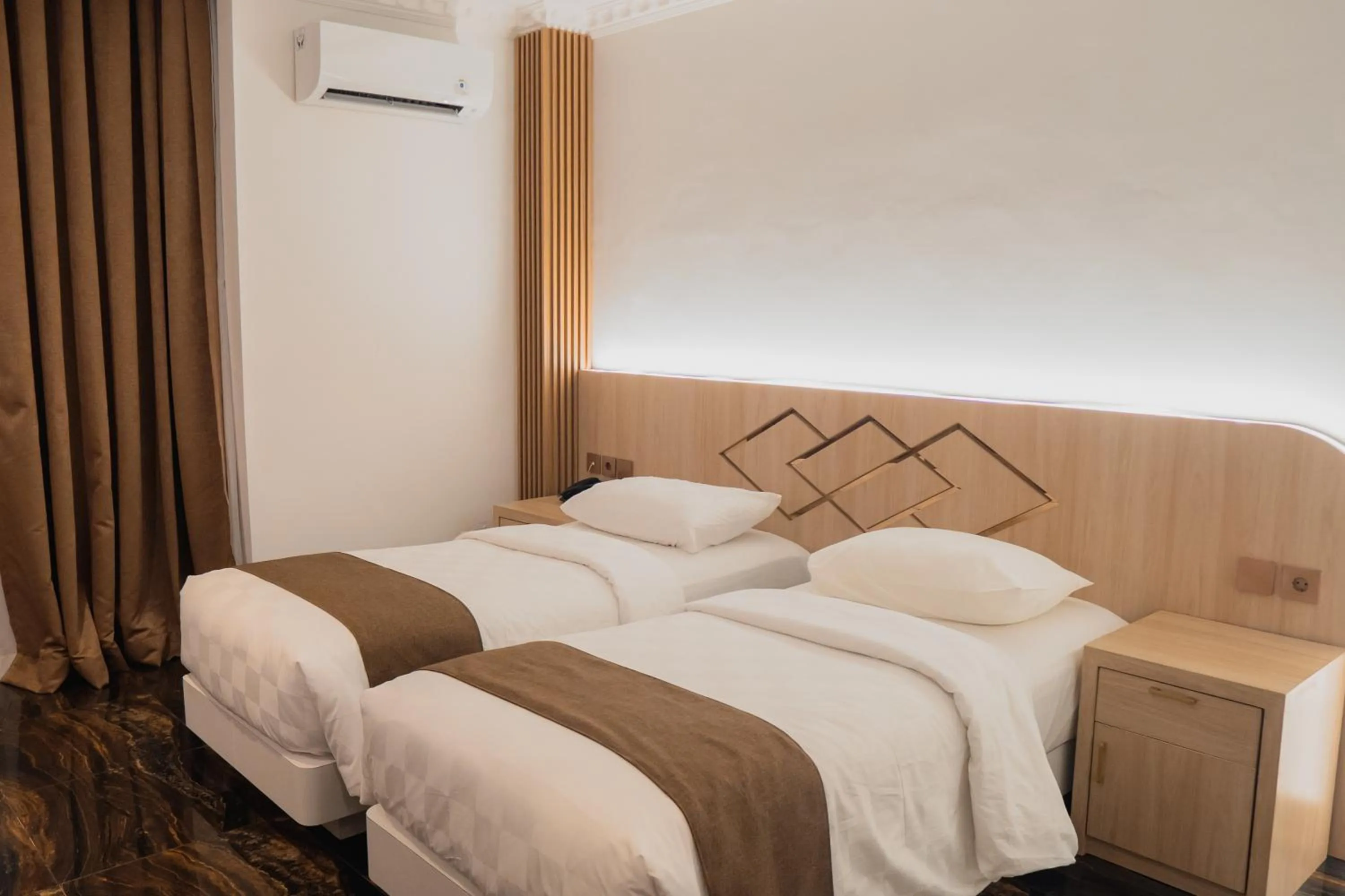 Bed in Fahira Hotel Syariah Padang