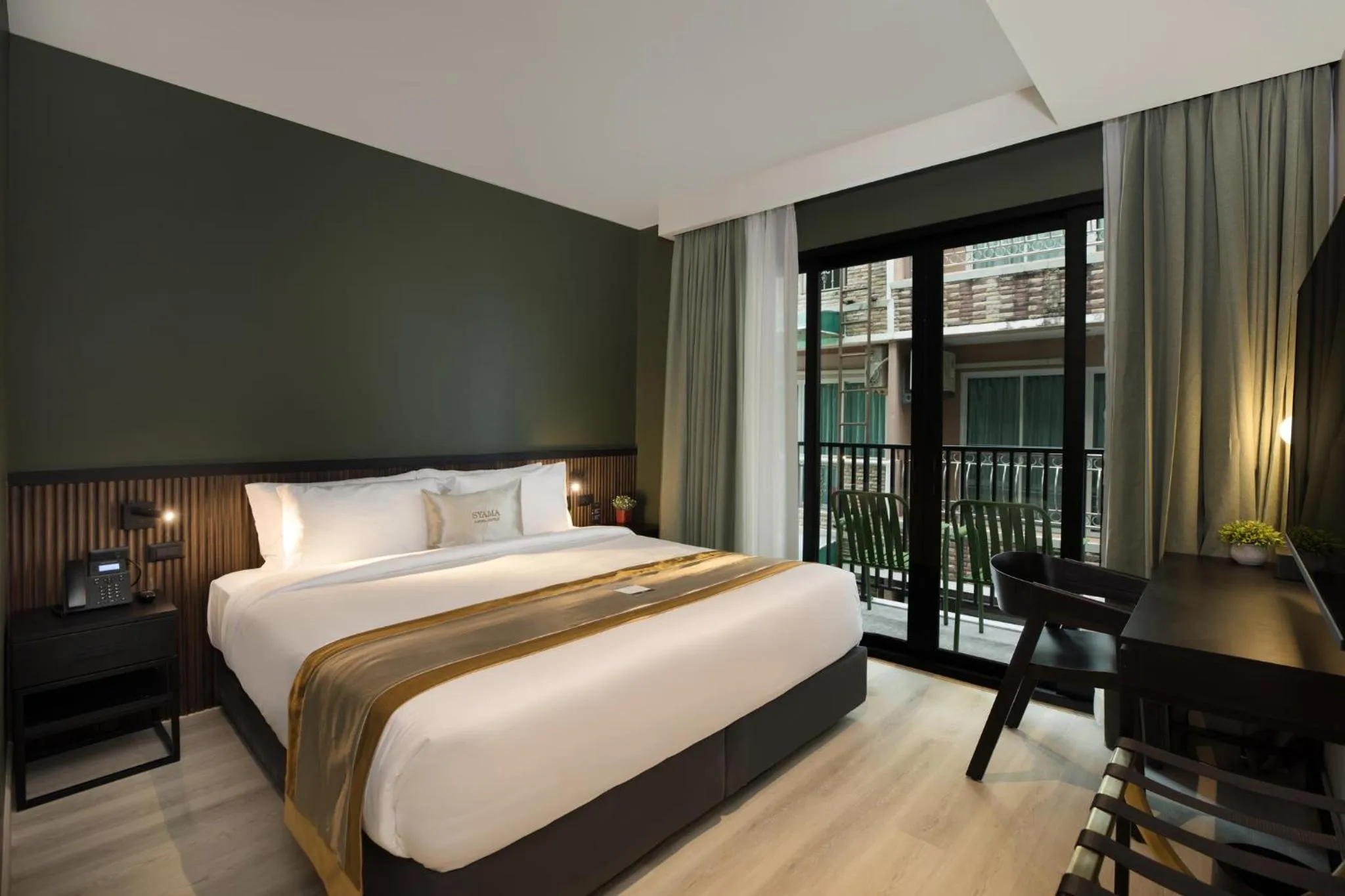 Bed in Syama Mansion Patong, an Aspira Collection