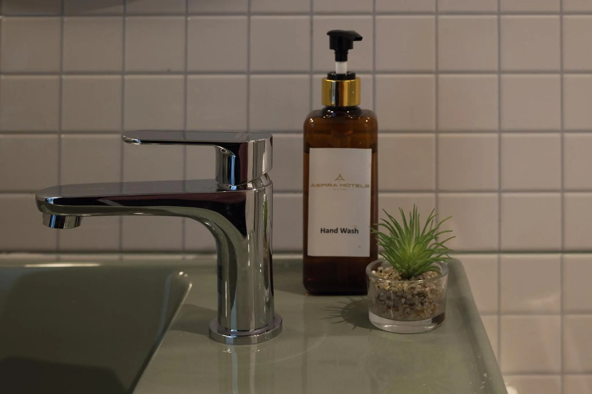 Toilet in Syama Mansion Patong, an Aspira Collection