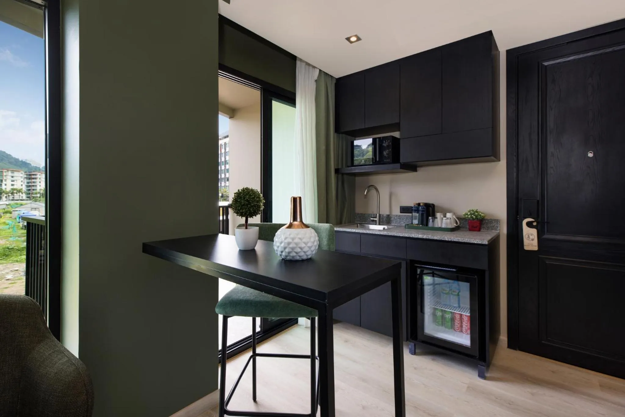 Dining area in Syama Mansion Patong, an Aspira Collection