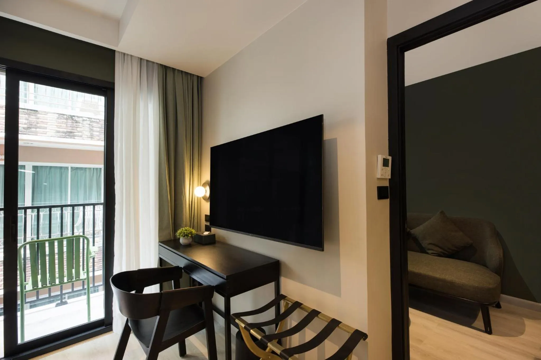 Communal lounge/ TV room in Syama Mansion Patong, an Aspira Collection