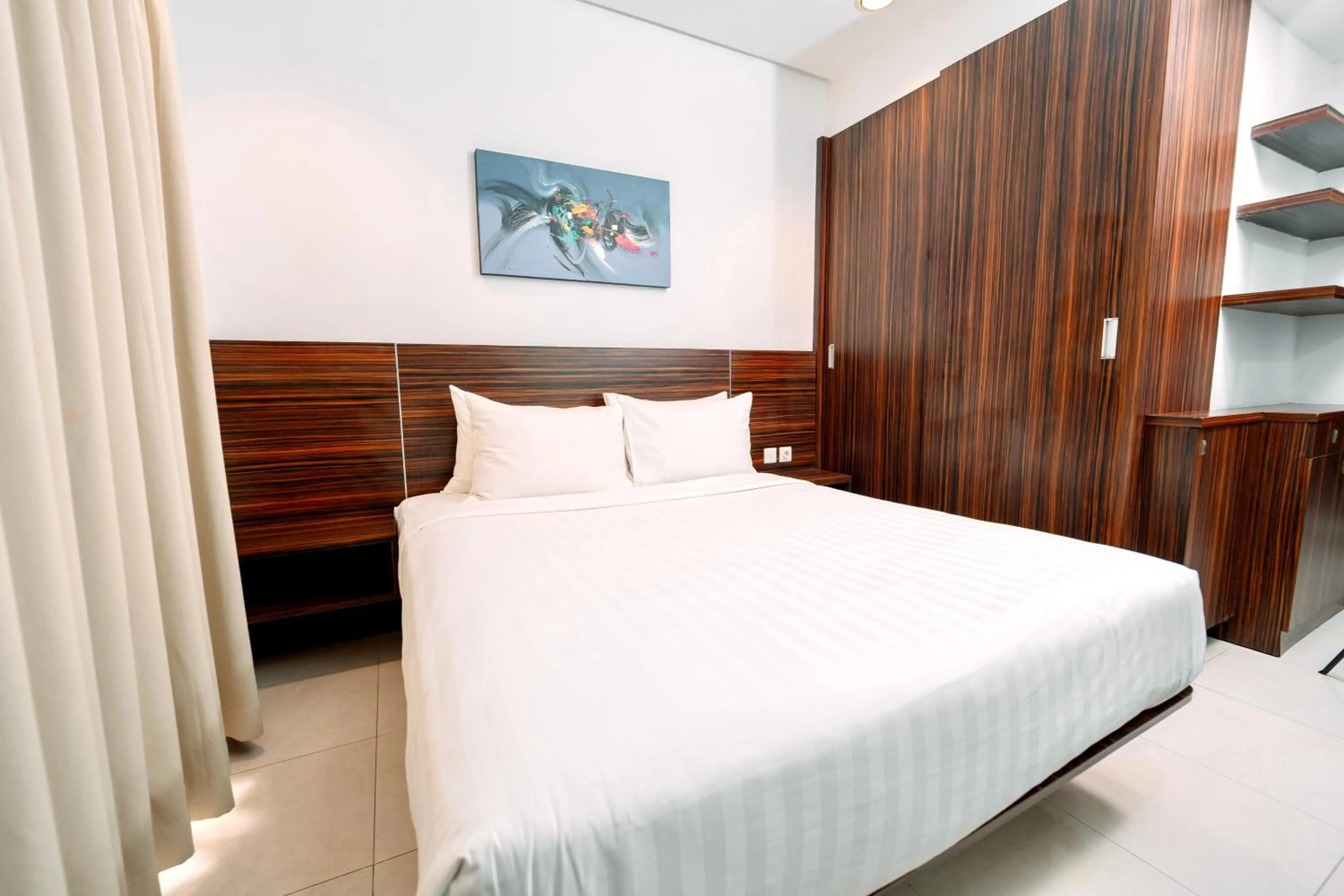 Bed in Shankee Suites Sudirman