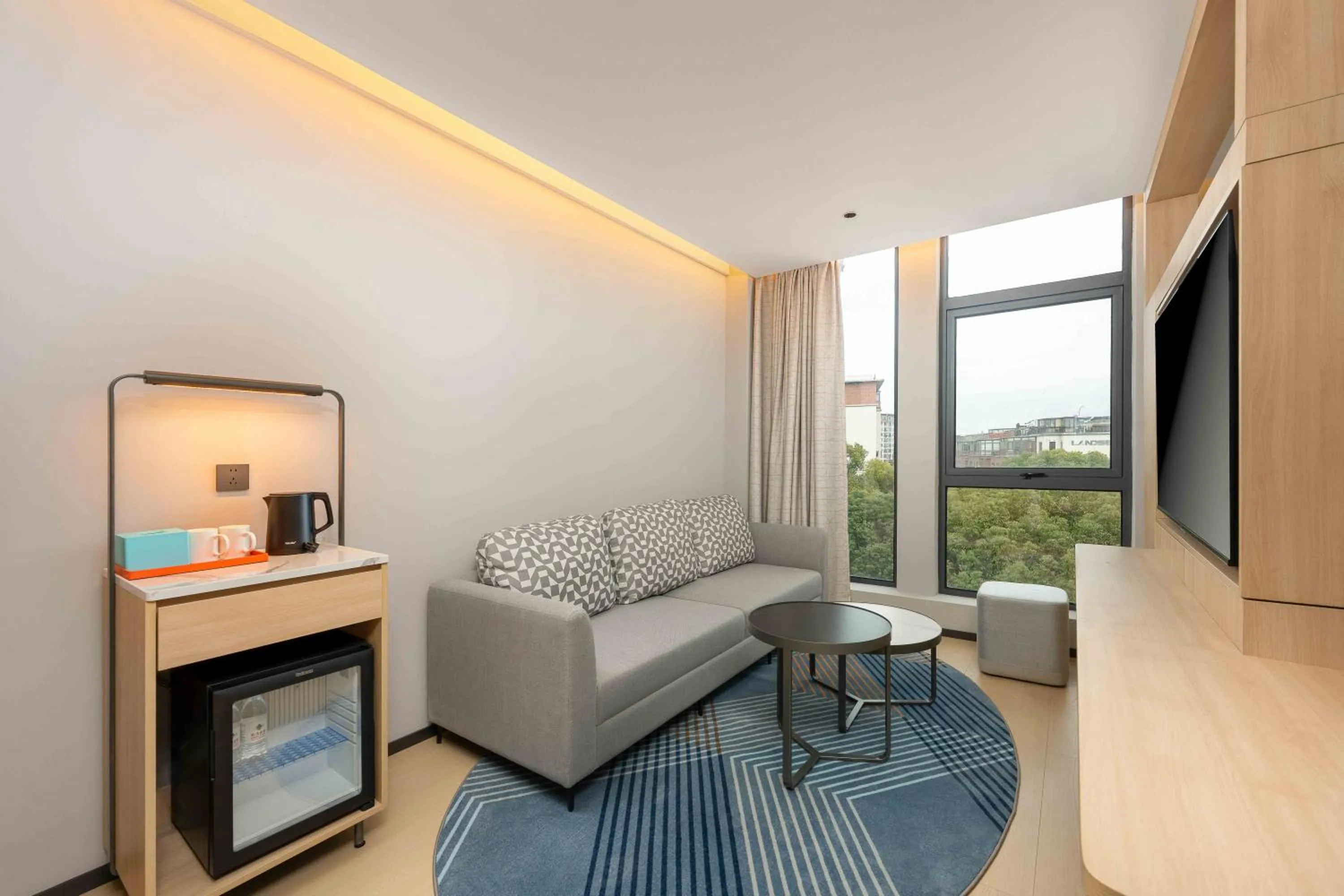 Living room in Holiday Inn Express Shanghai PVG Airport Zhuqiao - Free shuttle bus to Pudong Airport and Disneyland