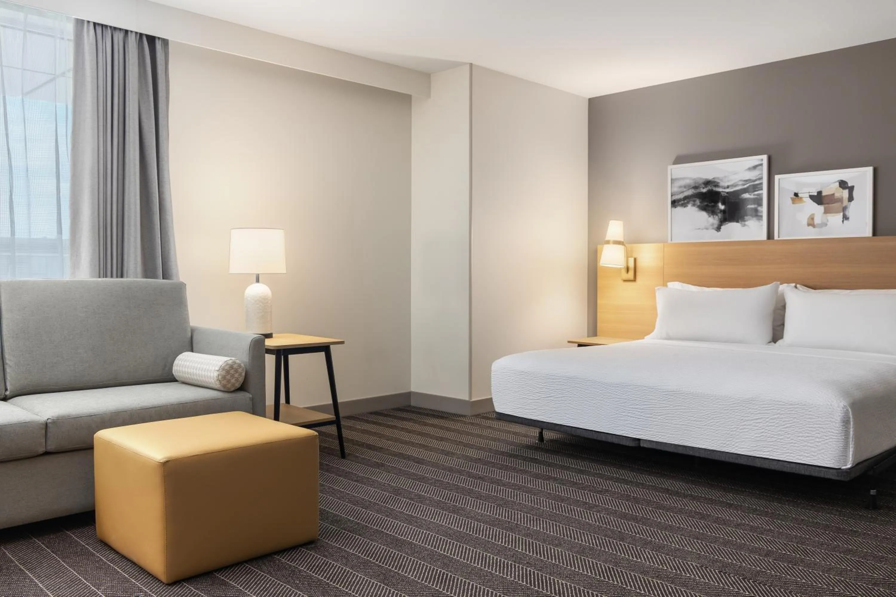 Living room, Bed in Staybridge Suites Montreal Airport - St-Laurent by IHG