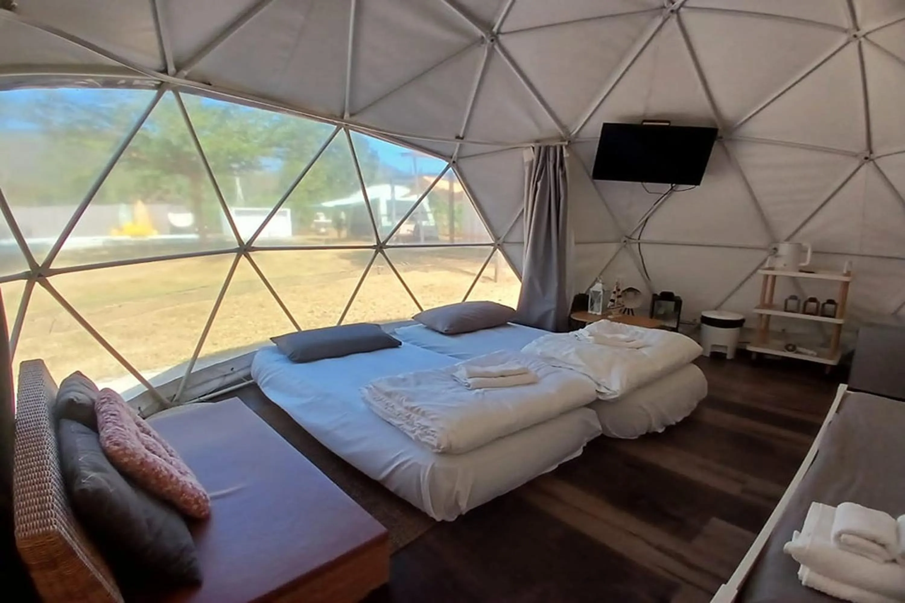 Bed in NaNine Glamping